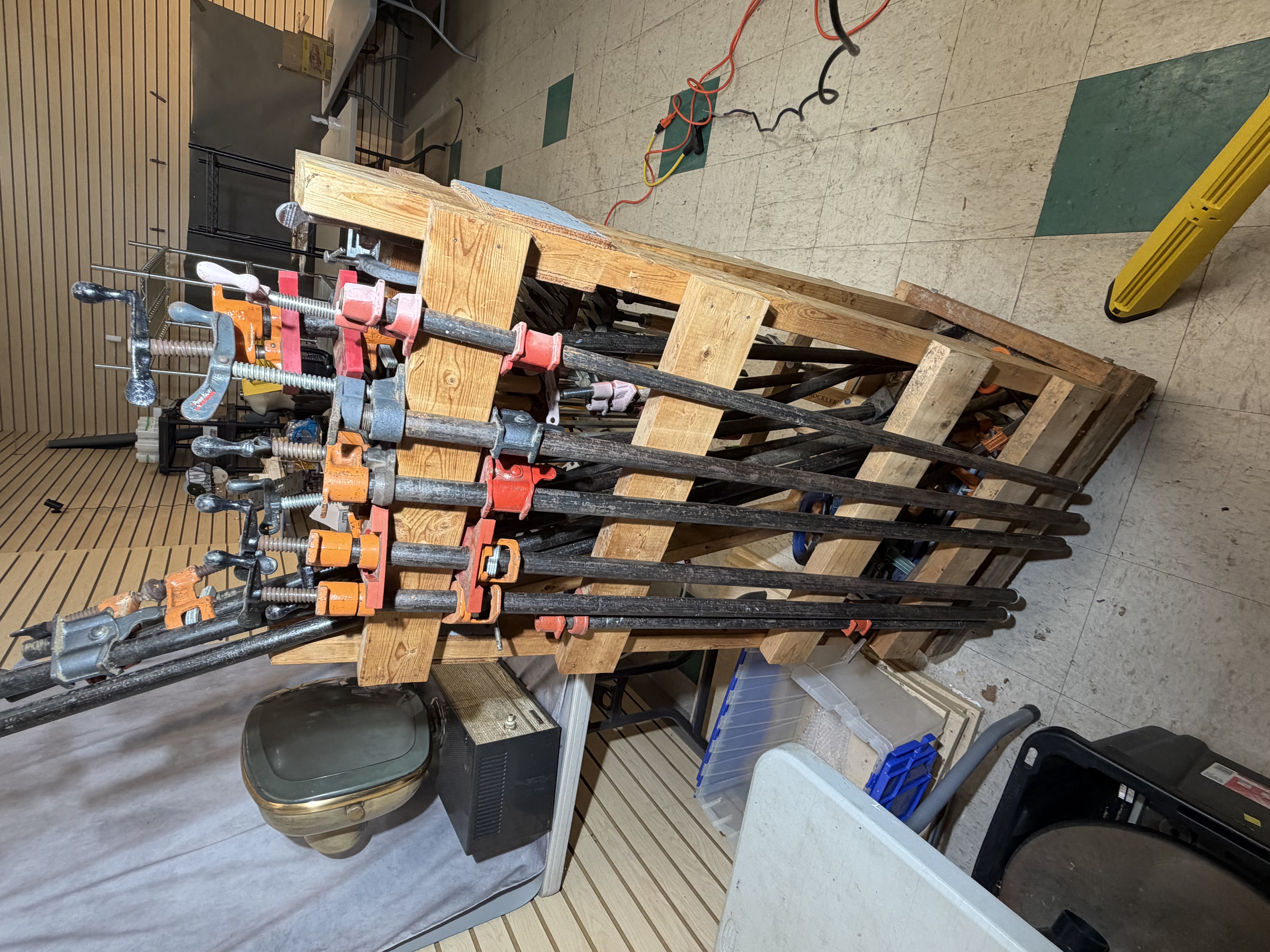 A Collection of Woodworking Clamps and a Mobile Storage Rack