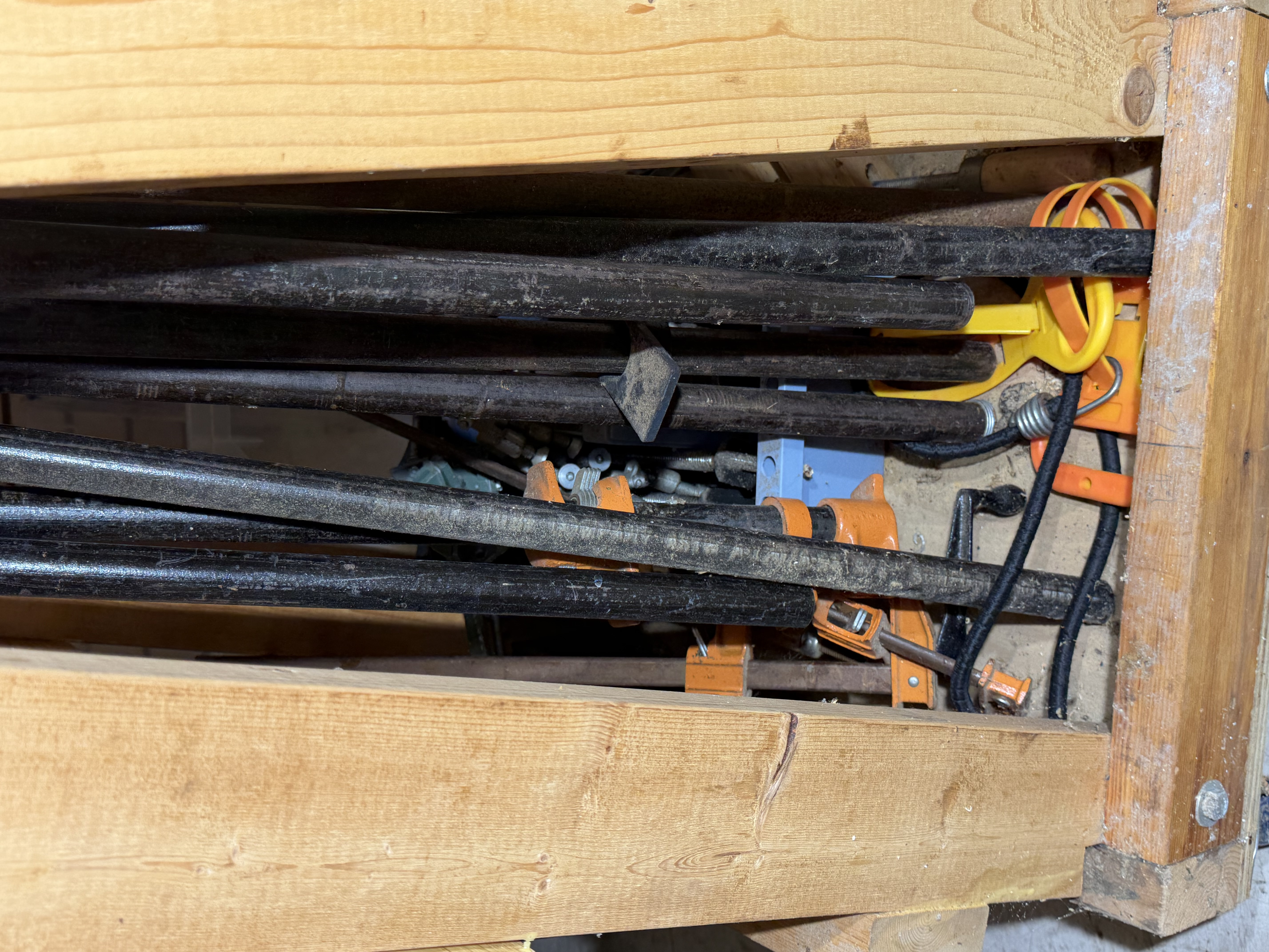A Collection of Woodworking Clamps and a Mobile Storage Rack