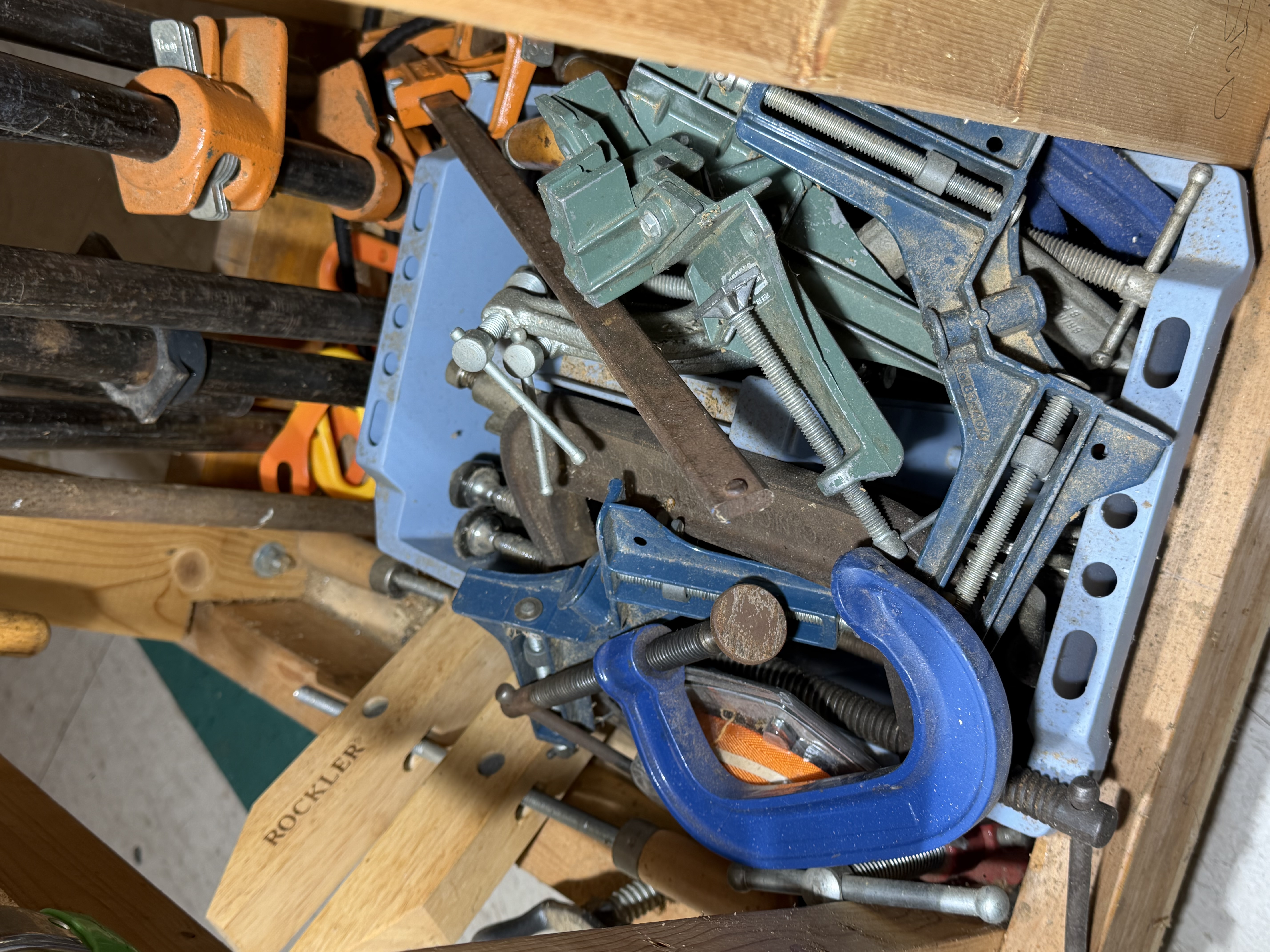 A Collection of Woodworking Clamps and a Mobile Storage Rack