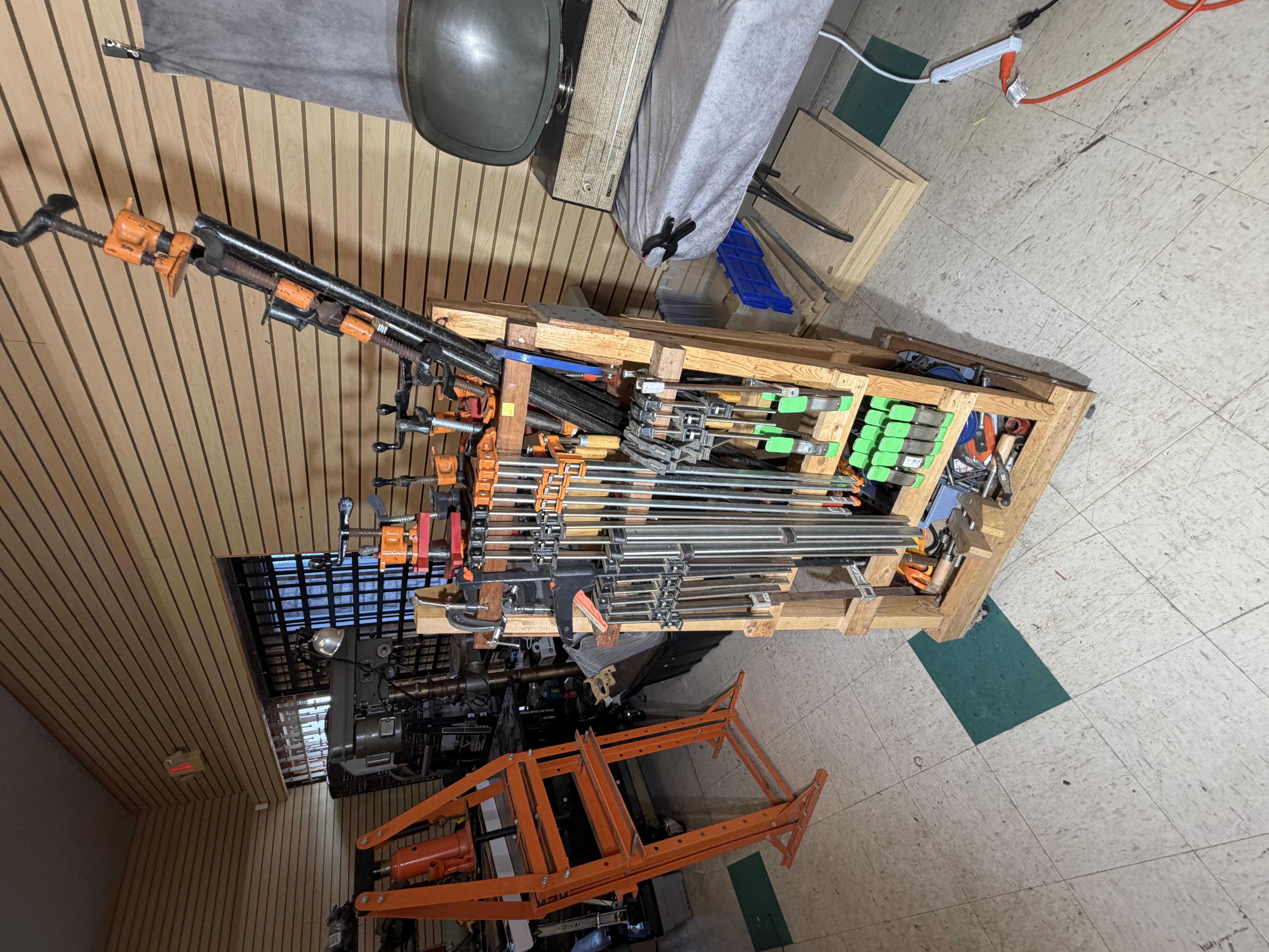 A Collection of Woodworking Clamps and a Mobile Storage Rack