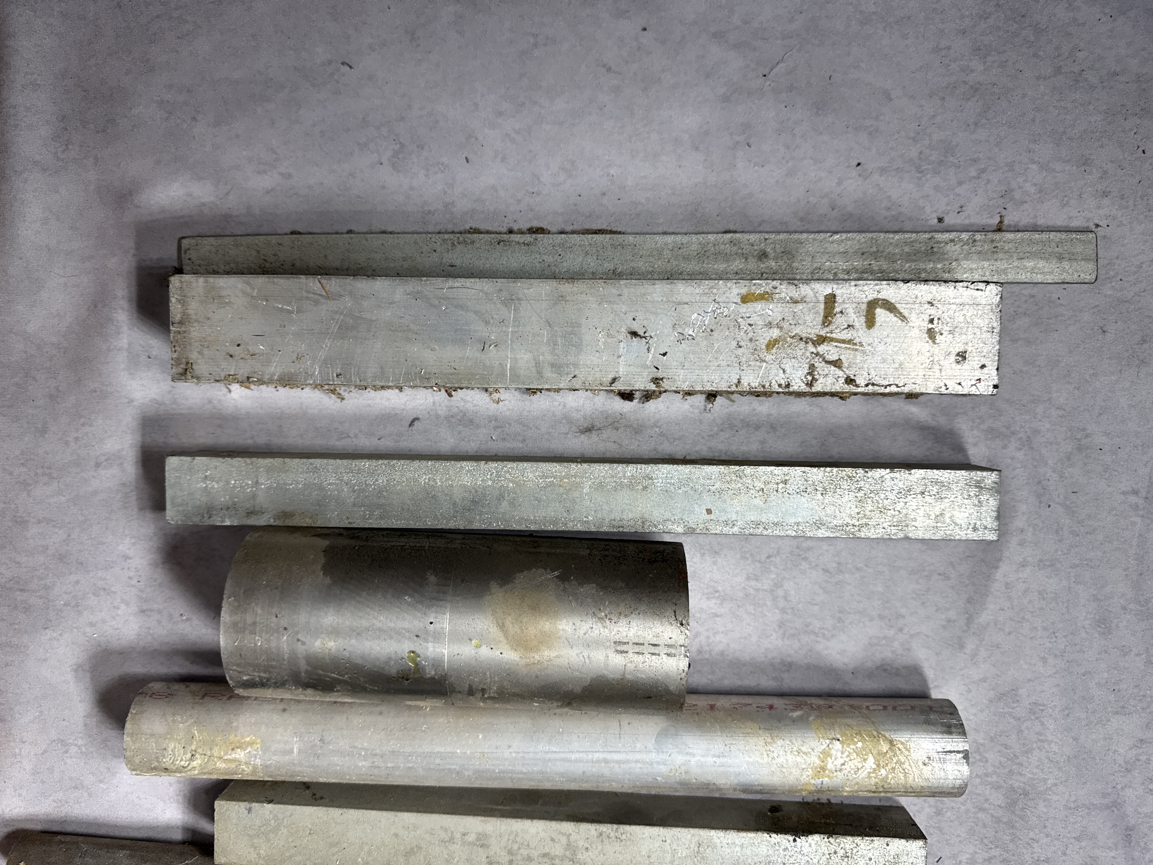 An Assortment of Industrial Metalworking Tools and Machining Stock