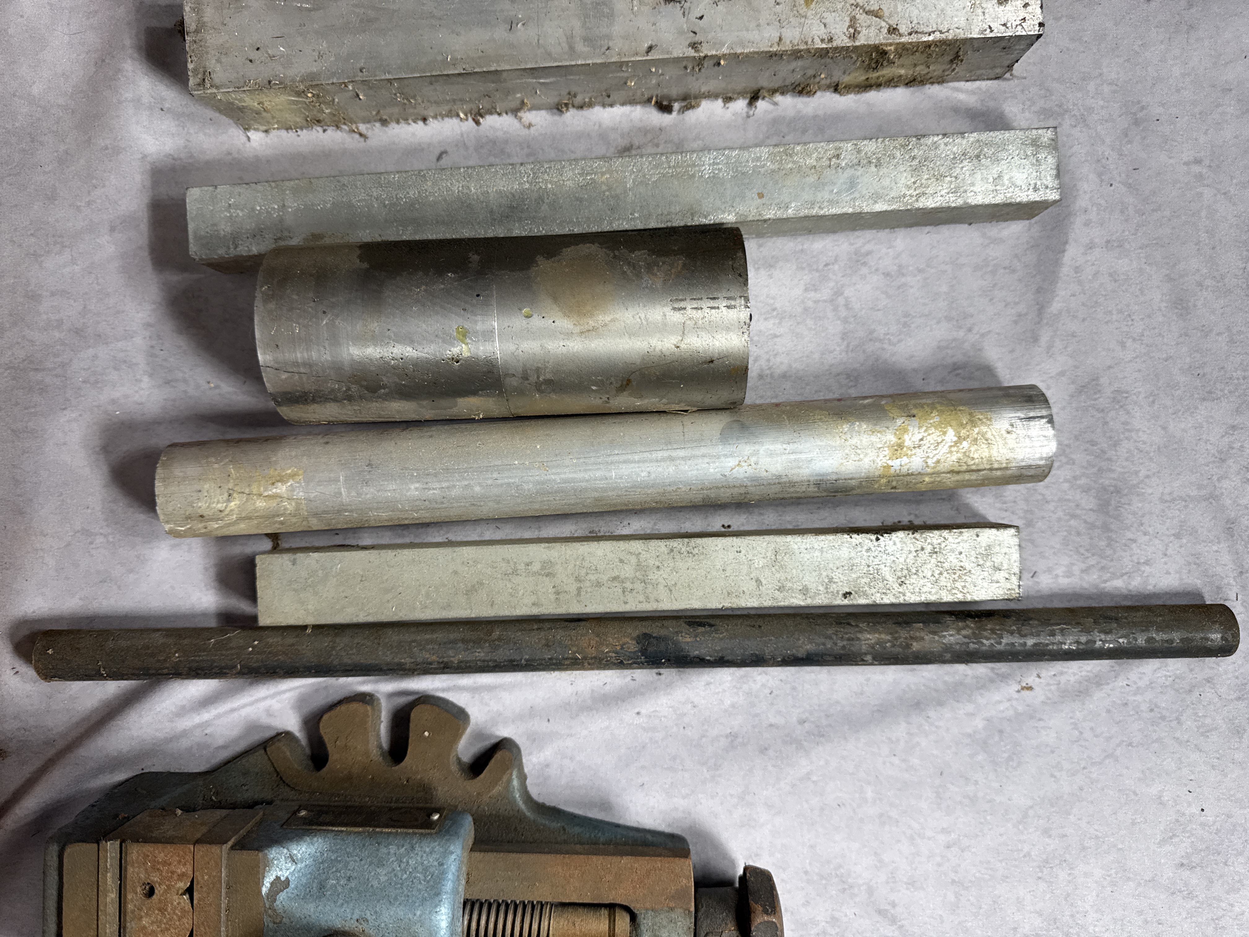 An Assortment of Industrial Metalworking Tools and Machining Stock