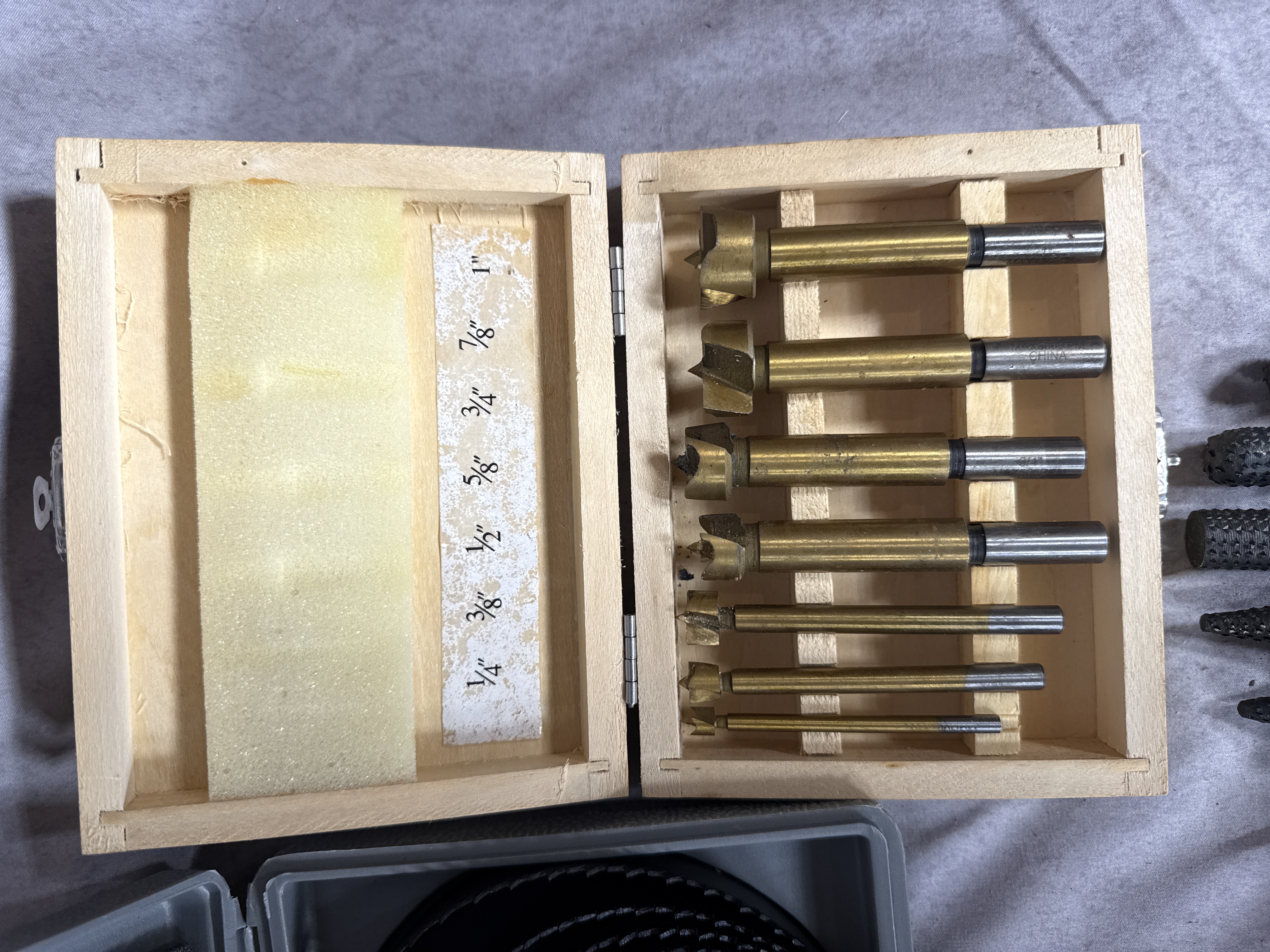 An Assortment of Drilling and Boring Tools Including Hole Saws and Bit Sets