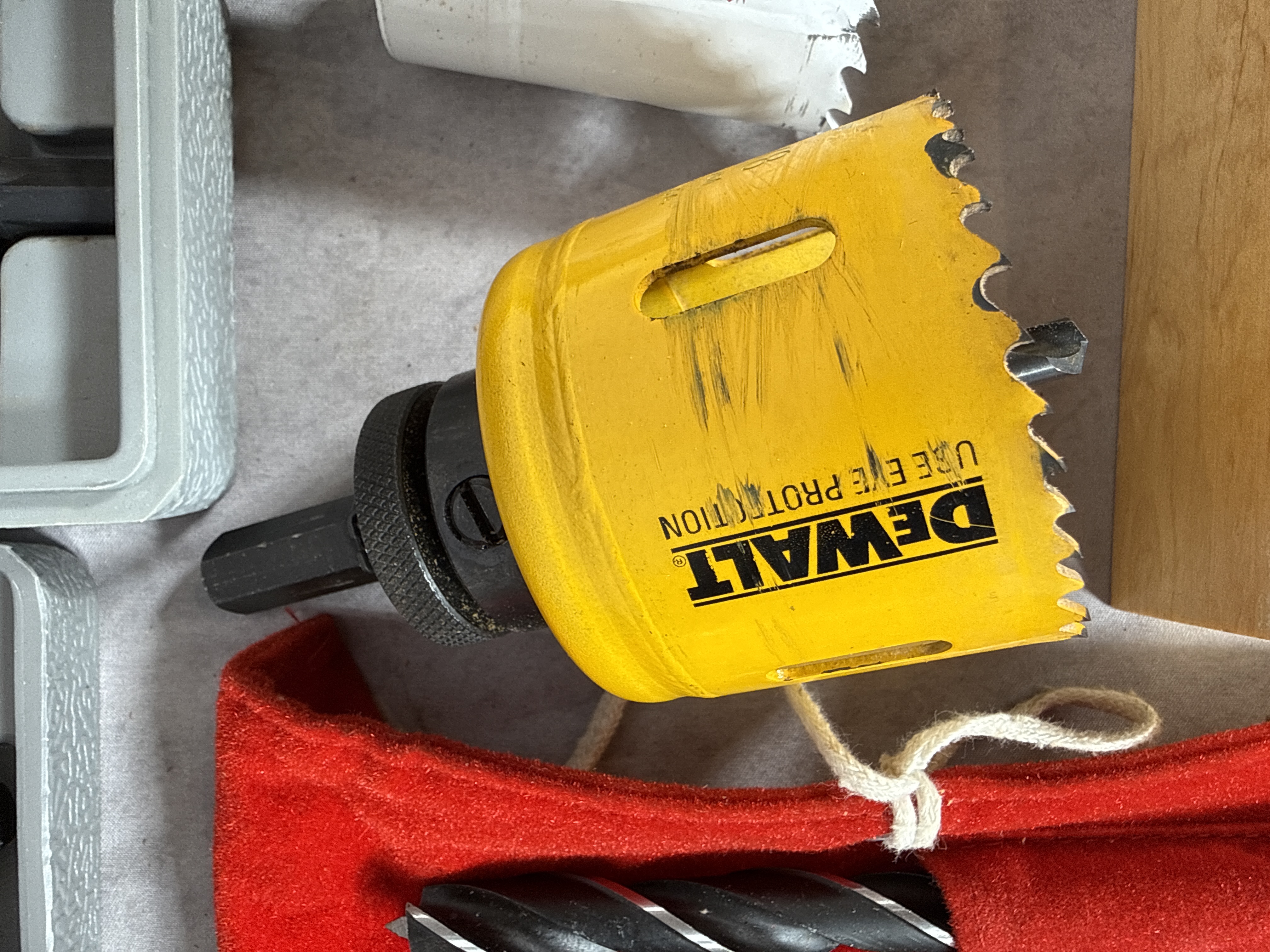 An Assortment of Drilling and Boring Tools Including Hole Saws and Bit Sets