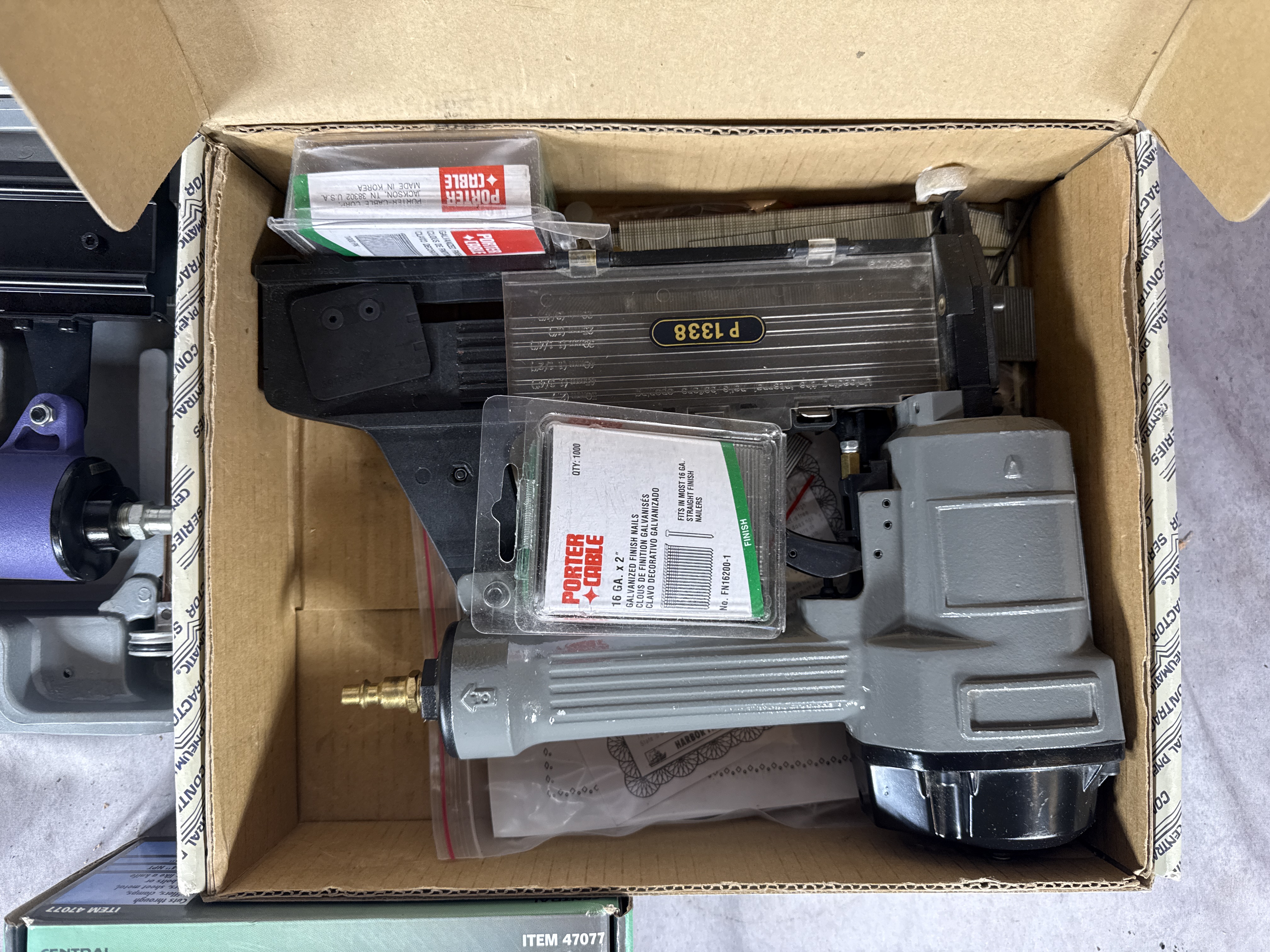 An Assortment of Pneumatic Power Tools and Accessories Including Central Pneumatic, Blue-Point, and Marki