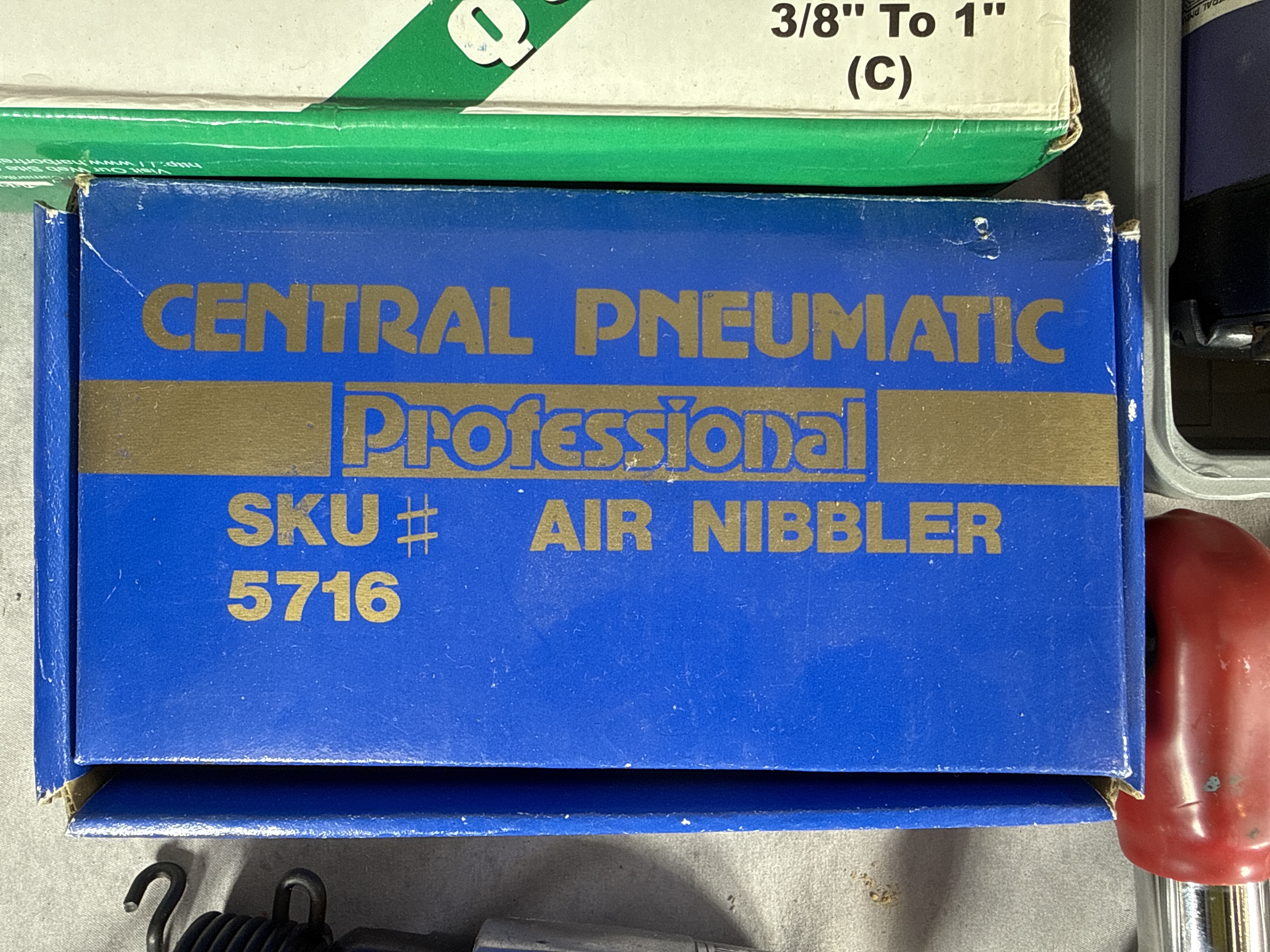 An Assortment of Pneumatic Power Tools and Accessories Including Central Pneumatic, Blue-Point, and Marki