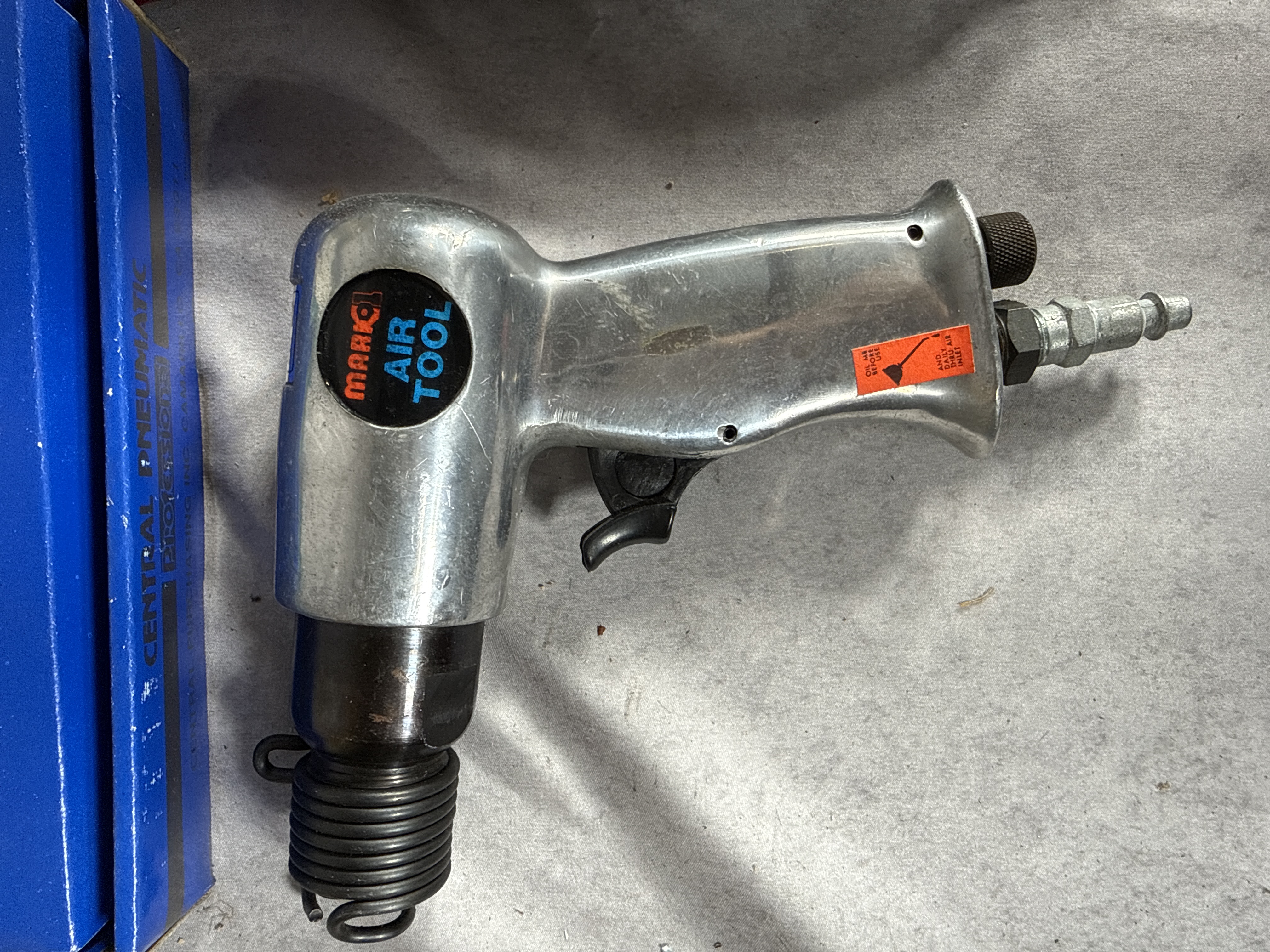 An Assortment of Pneumatic Power Tools and Accessories Including Central Pneumatic, Blue-Point, and Marki