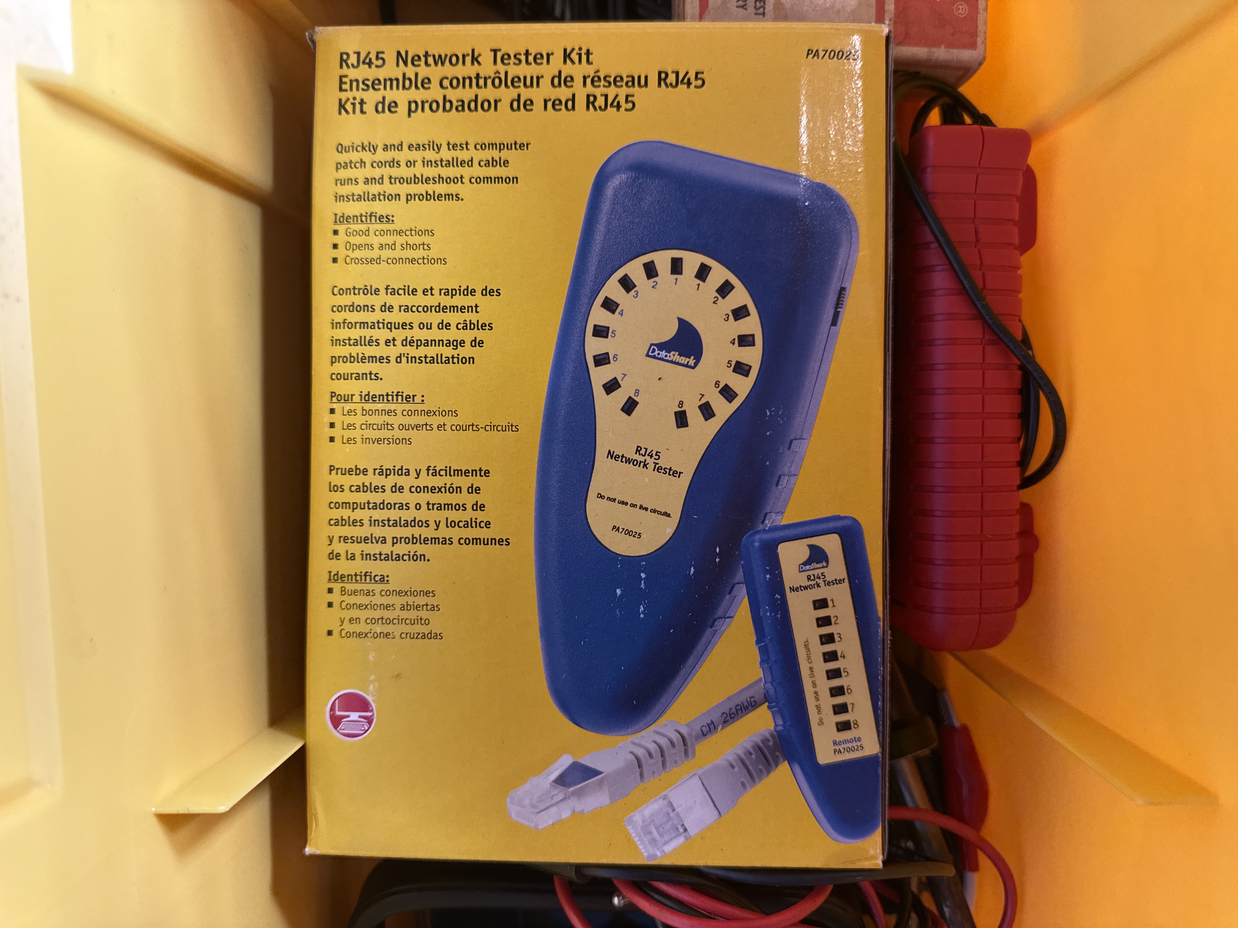 An Assortment of Electrical and Networking Tools and Supplies with a Yellow Plastic Toolbox