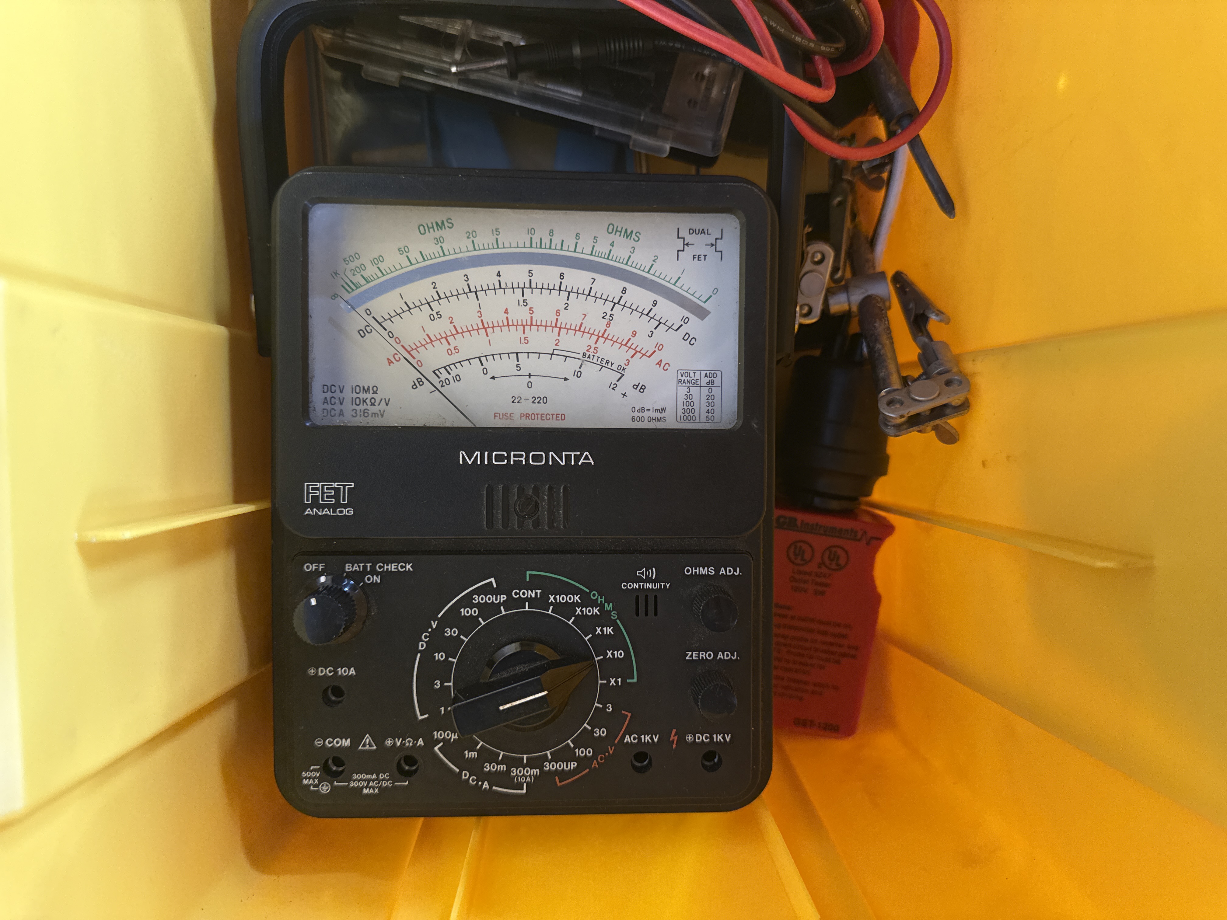 An Assortment of Electrical and Networking Tools and Supplies with a Yellow Plastic Toolbox