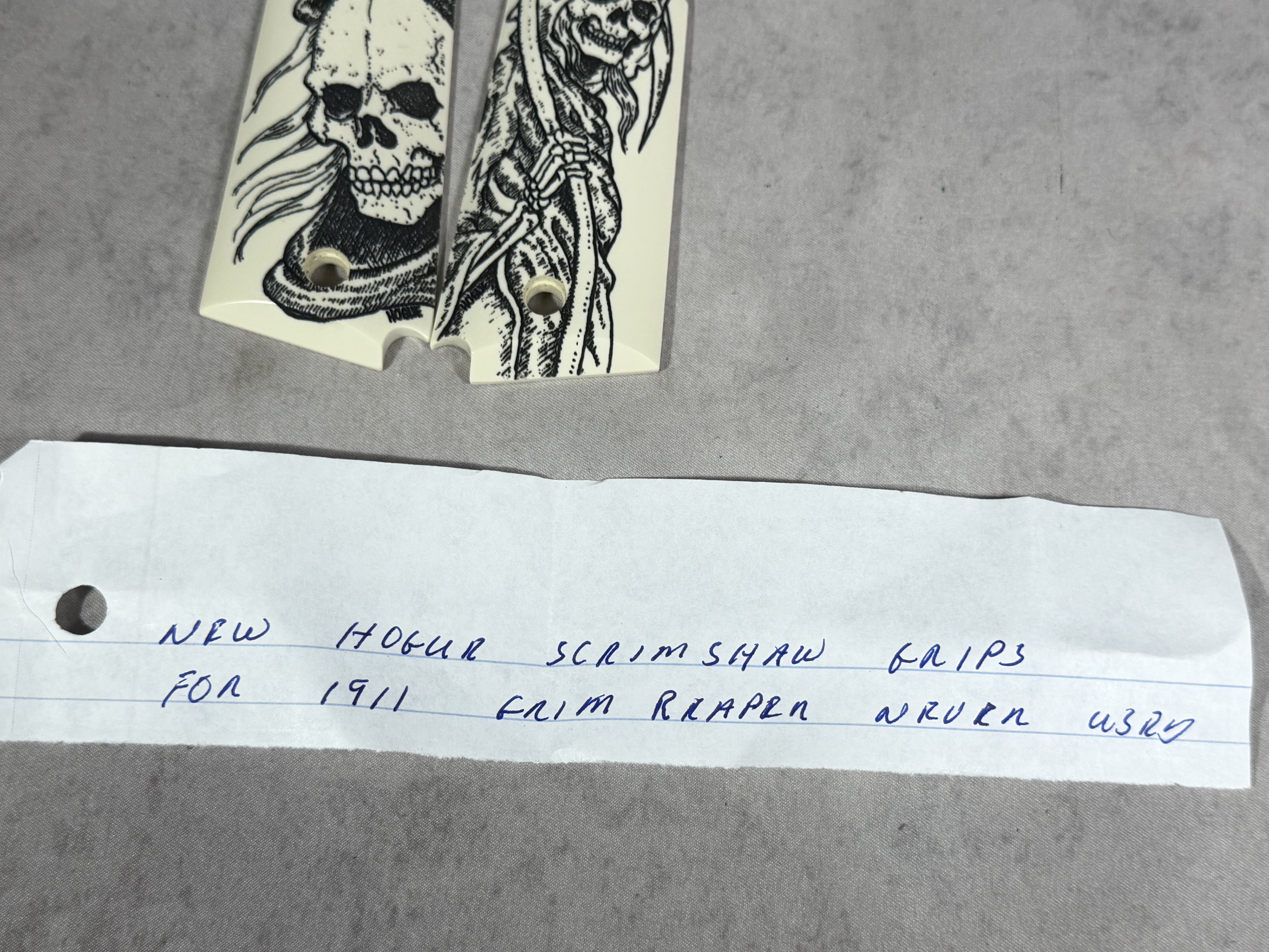 A Pair of Hogue Scrimshaw Polymer Grim Reaper 1911 Grips