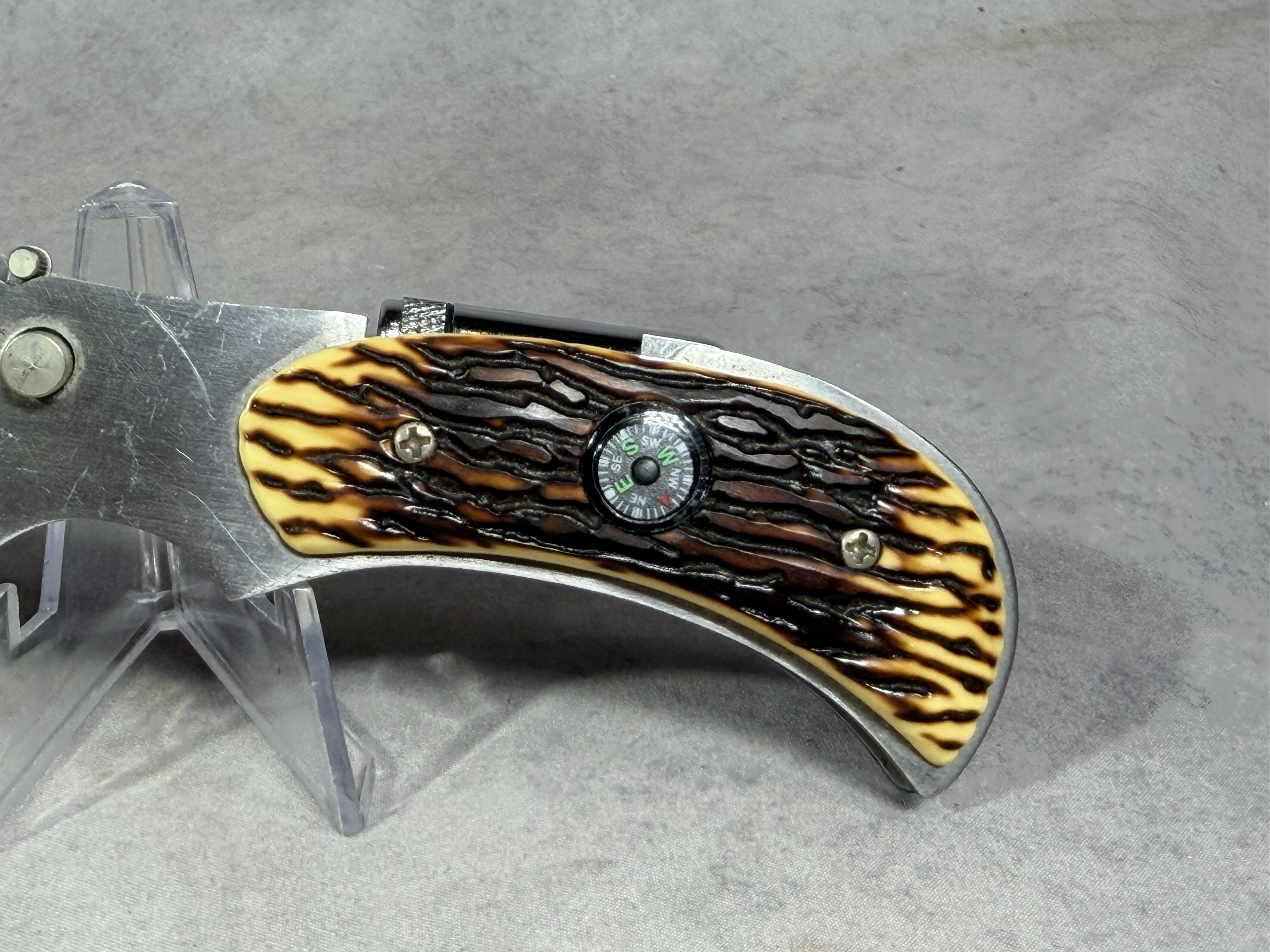 Folding Utility Pocket Knife with Integrated Compass and LED Flashlight