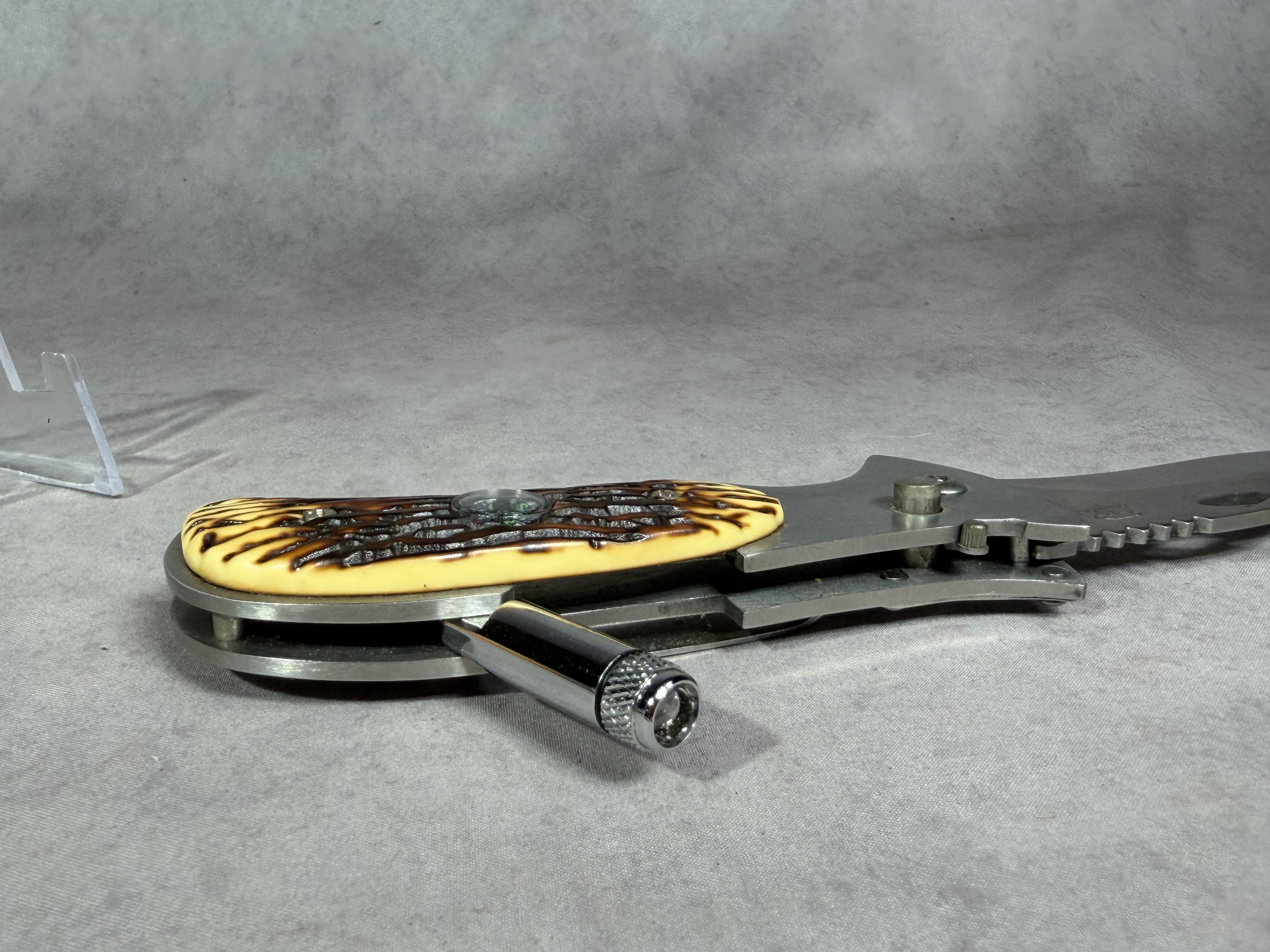 Folding Utility Pocket Knife with Integrated Compass and LED Flashlight