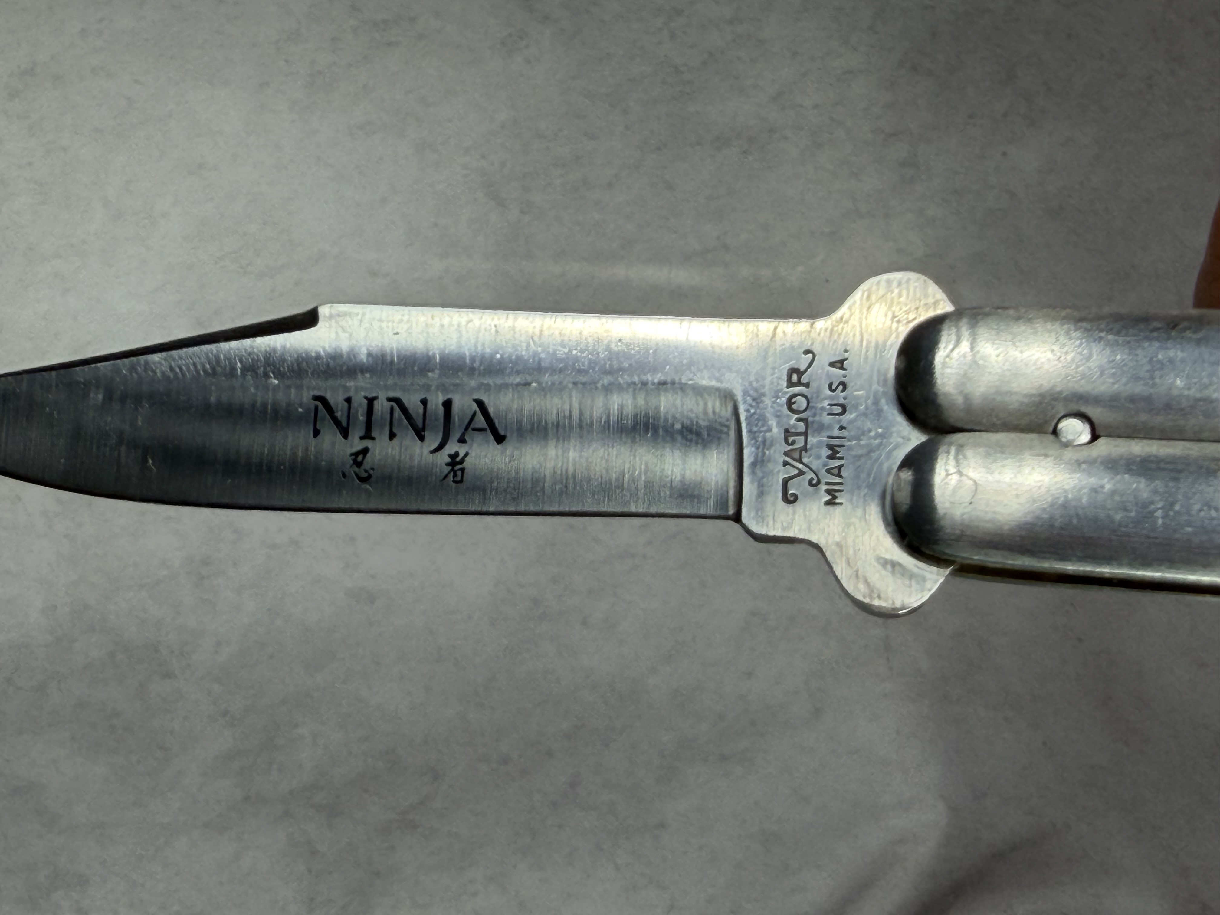 Four Folding and Fixed Blade Knives including Valor Ninja Balisong and Solingen Multi-Tool