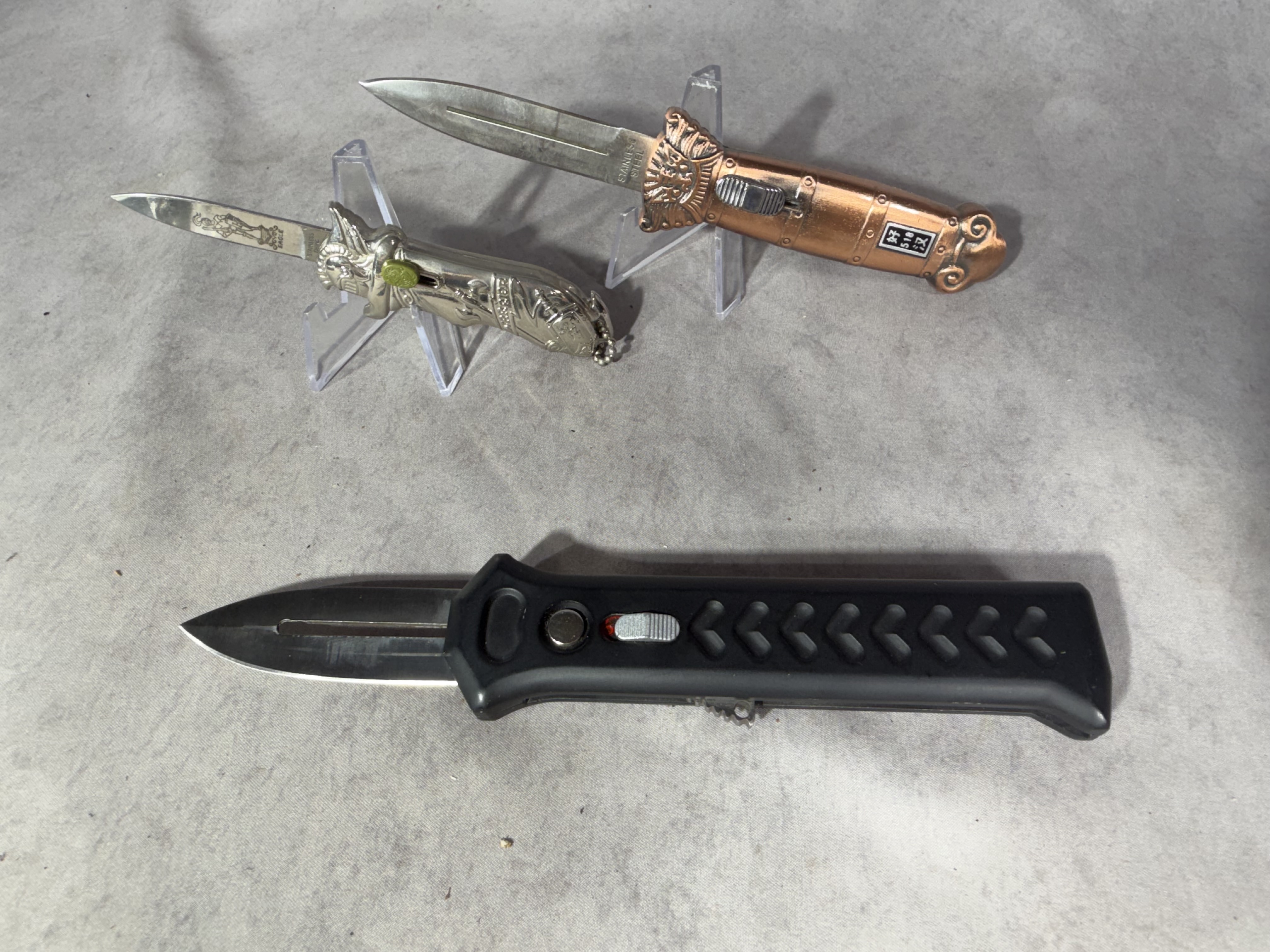 Three OTF Automatic Knives Including Solo Eagle Warrior and Lion Head Models