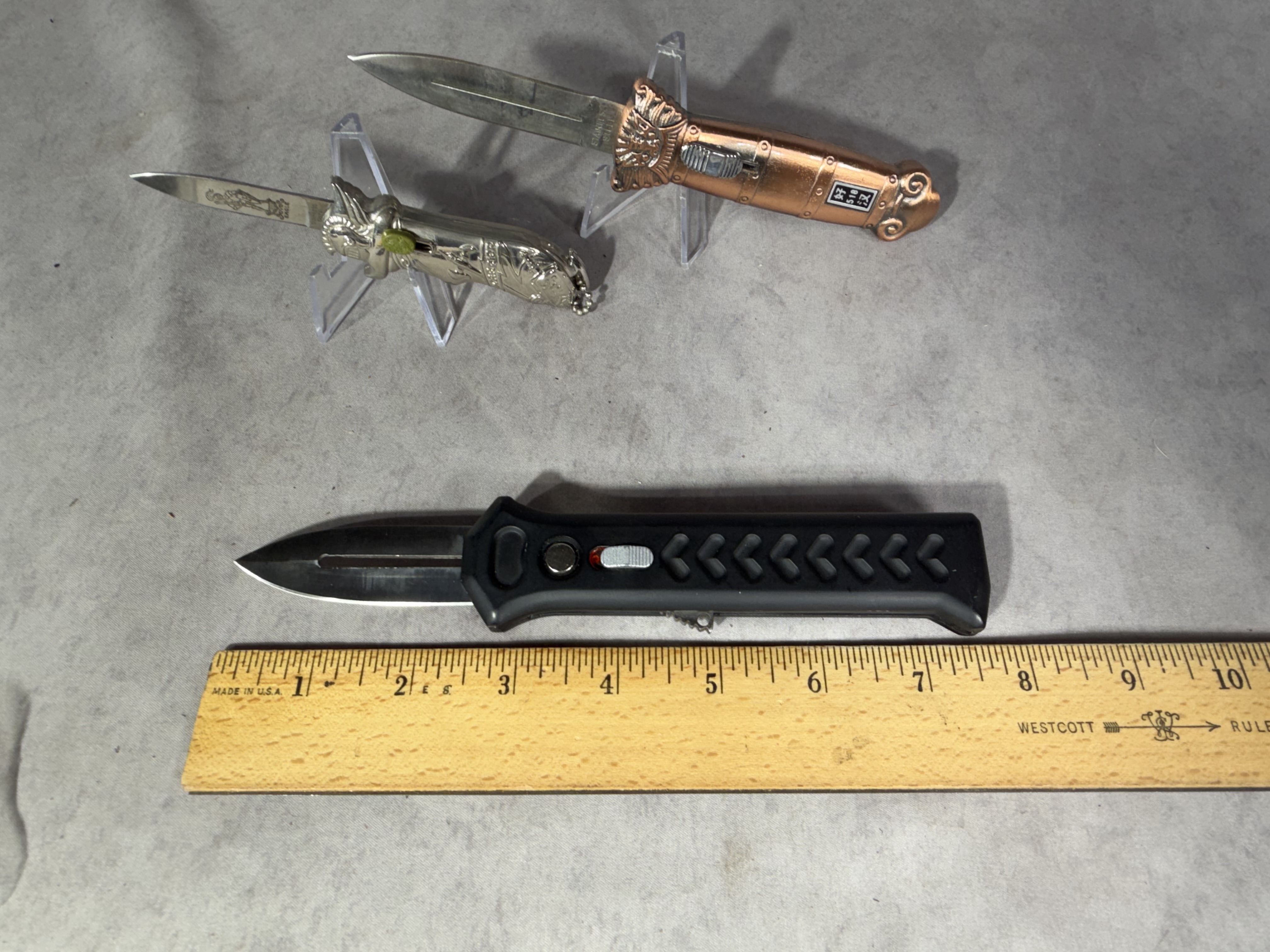 Three OTF Automatic Knives Including Solo Eagle Warrior and Lion Head Models