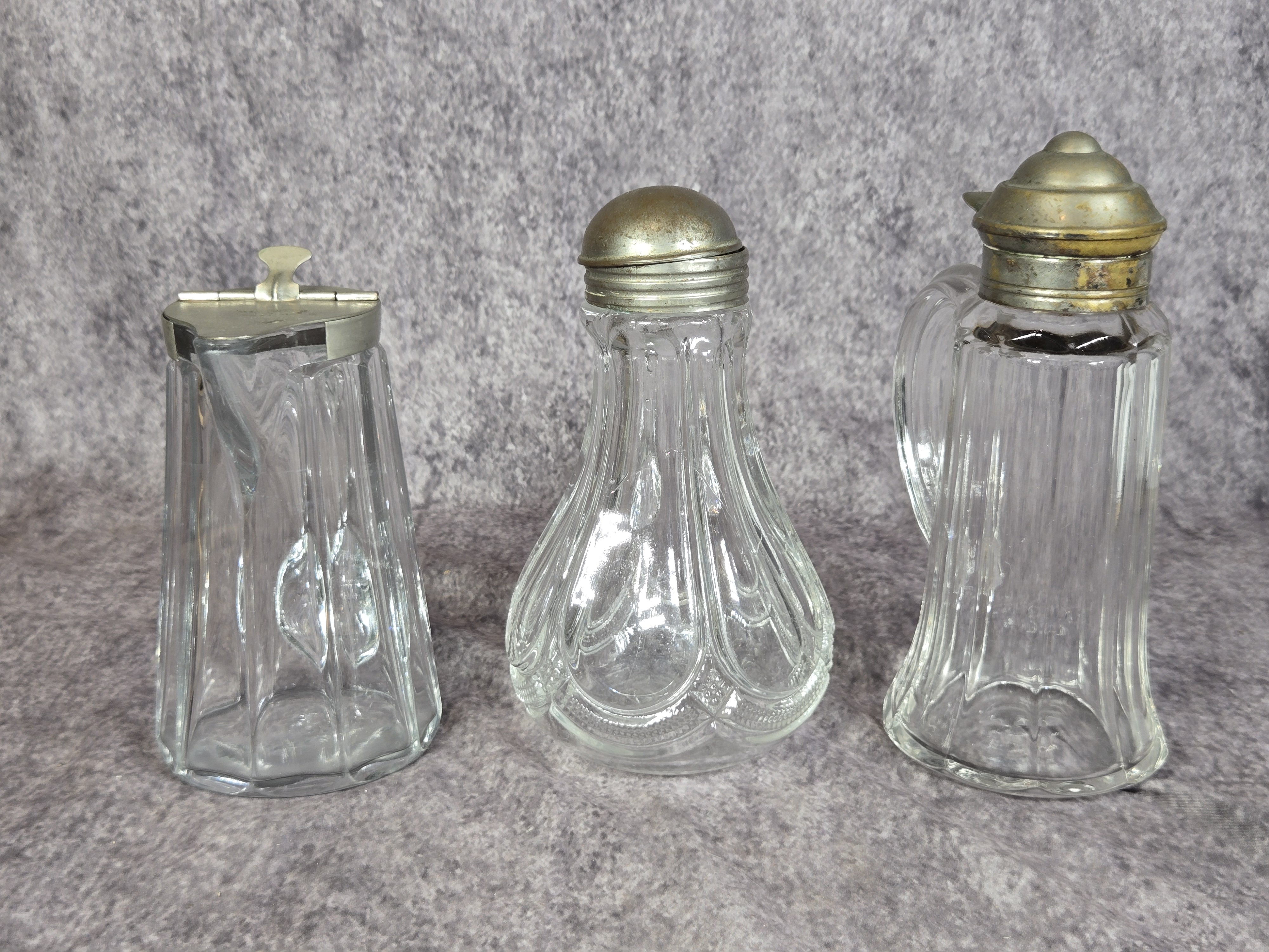 Three Antique Pressed Glass Syrup Pitchers with Metal Lids
