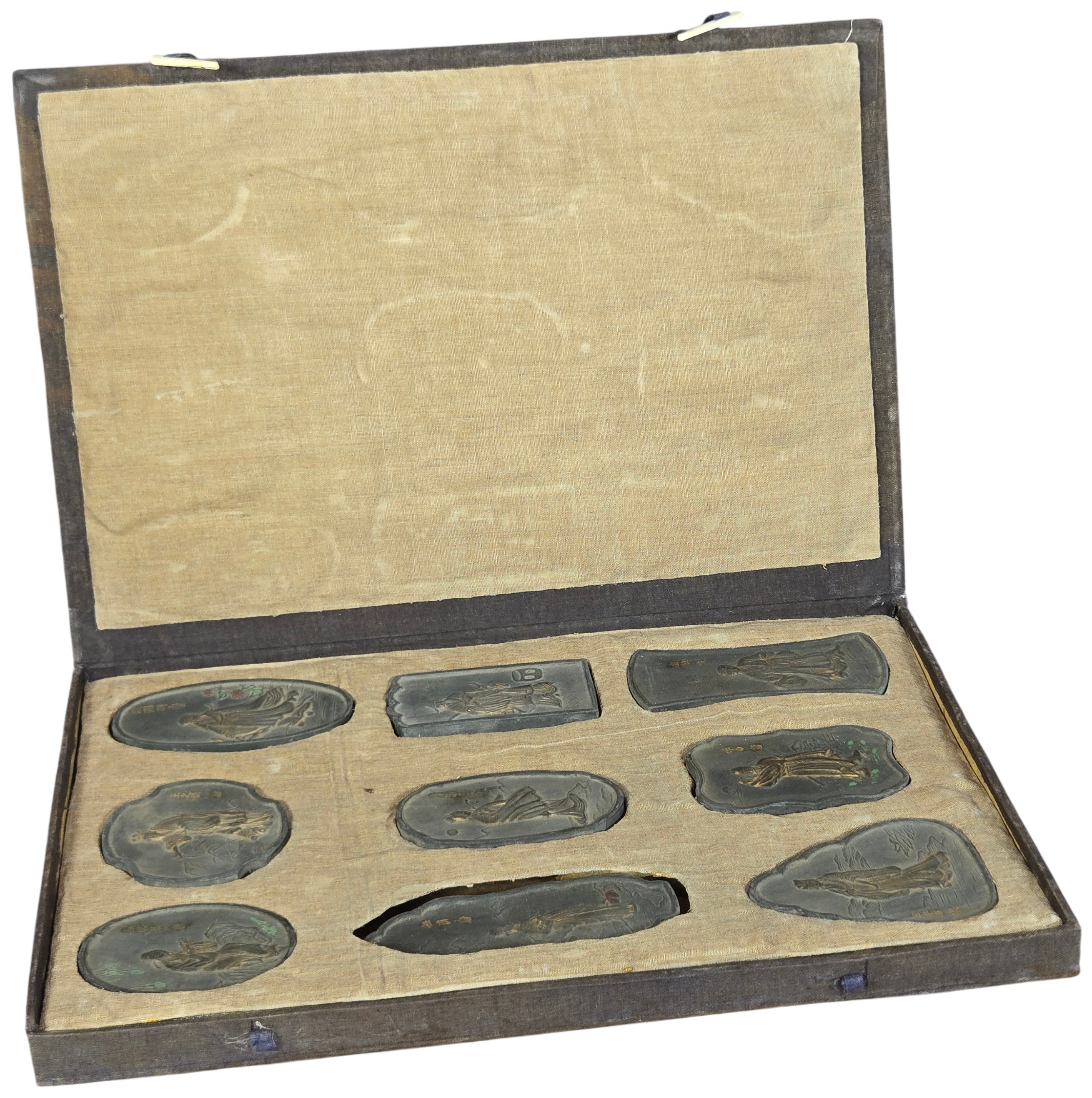 A Set of Nine Chinese Gilt and Polychrome Molded Inksticks