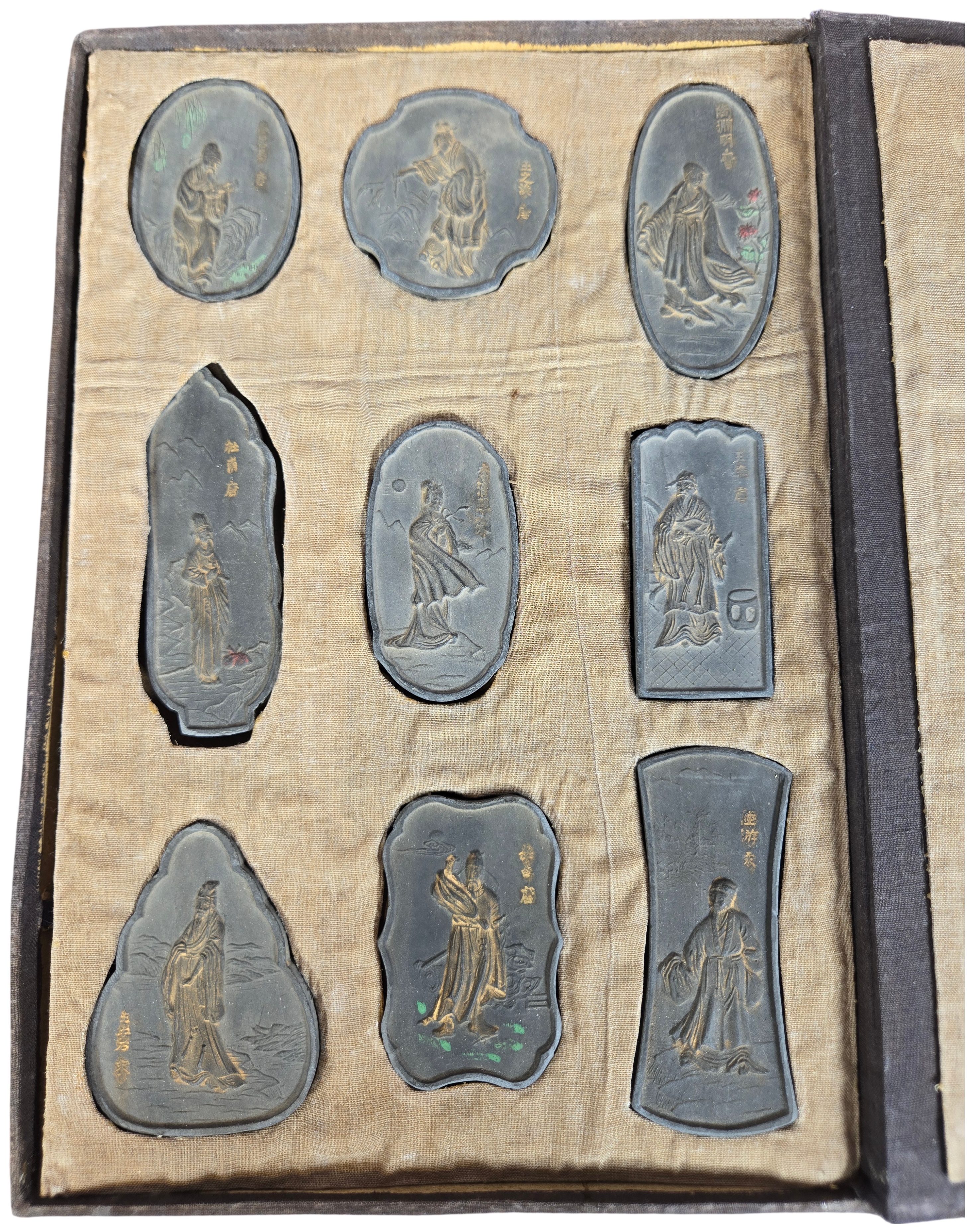 A Set of Nine Chinese Gilt and Polychrome Molded Inksticks