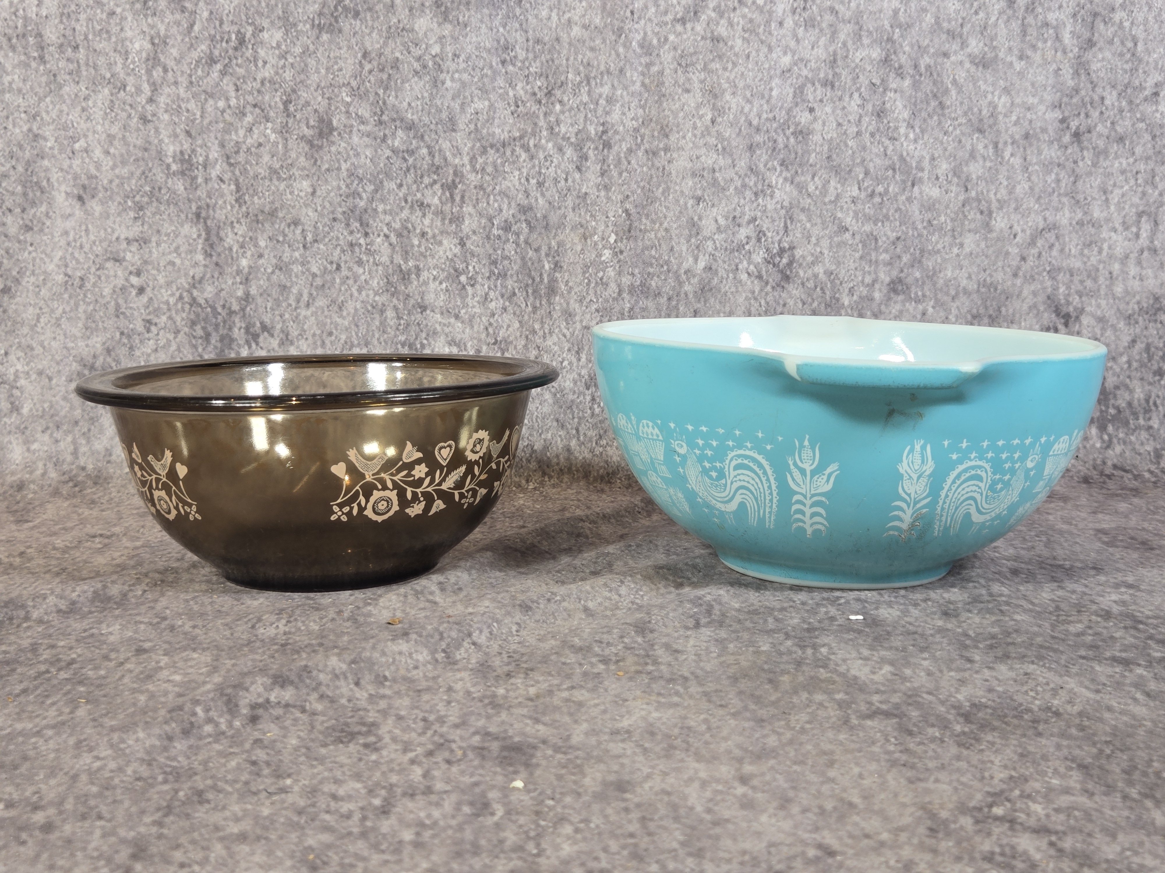 Two Vintage American Glass Mixing Bowls featuring Pyrex Butterprint and Corning Patterns