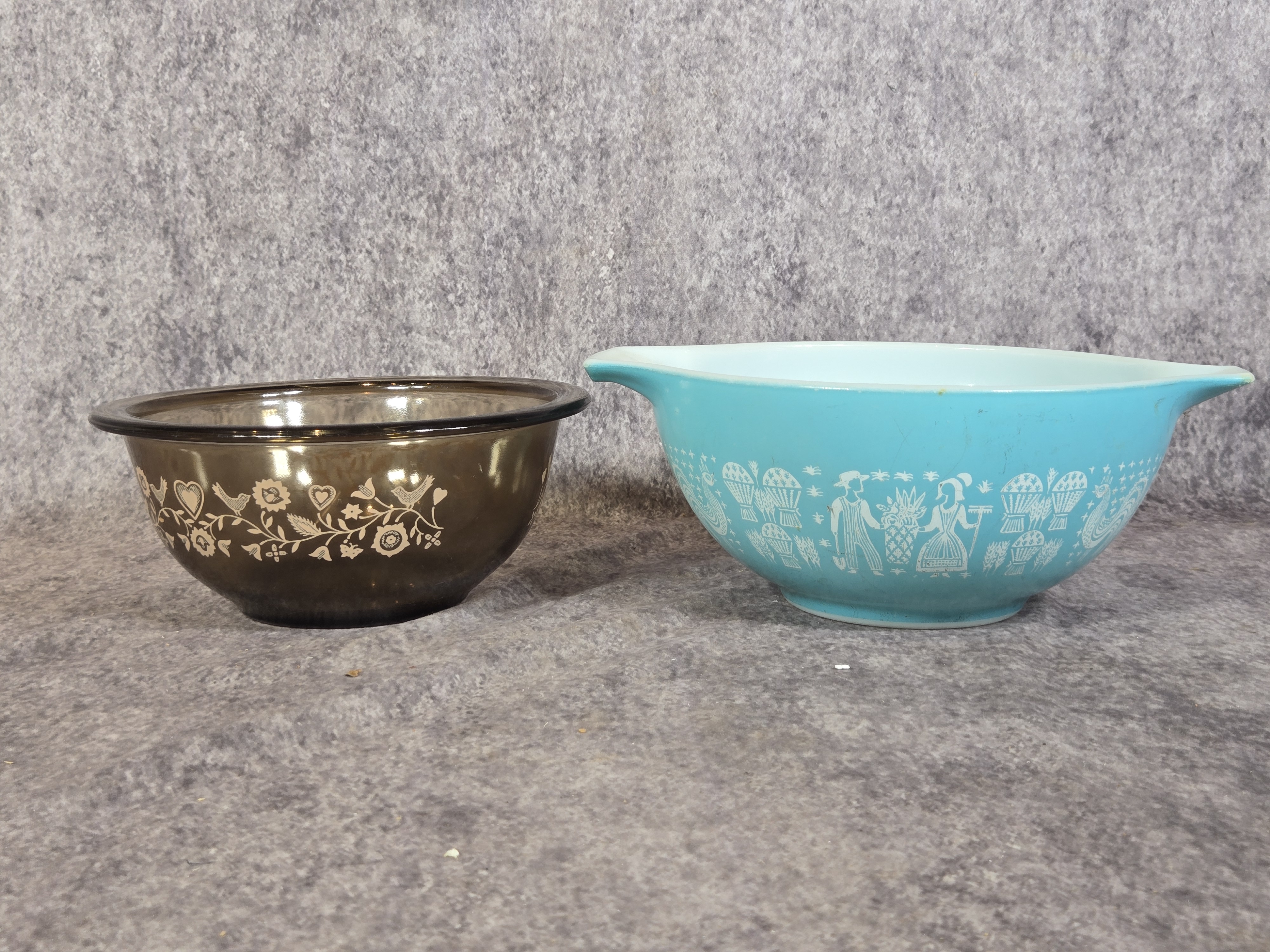 Two Vintage American Glass Mixing Bowls featuring Pyrex Butterprint and Corning Patterns