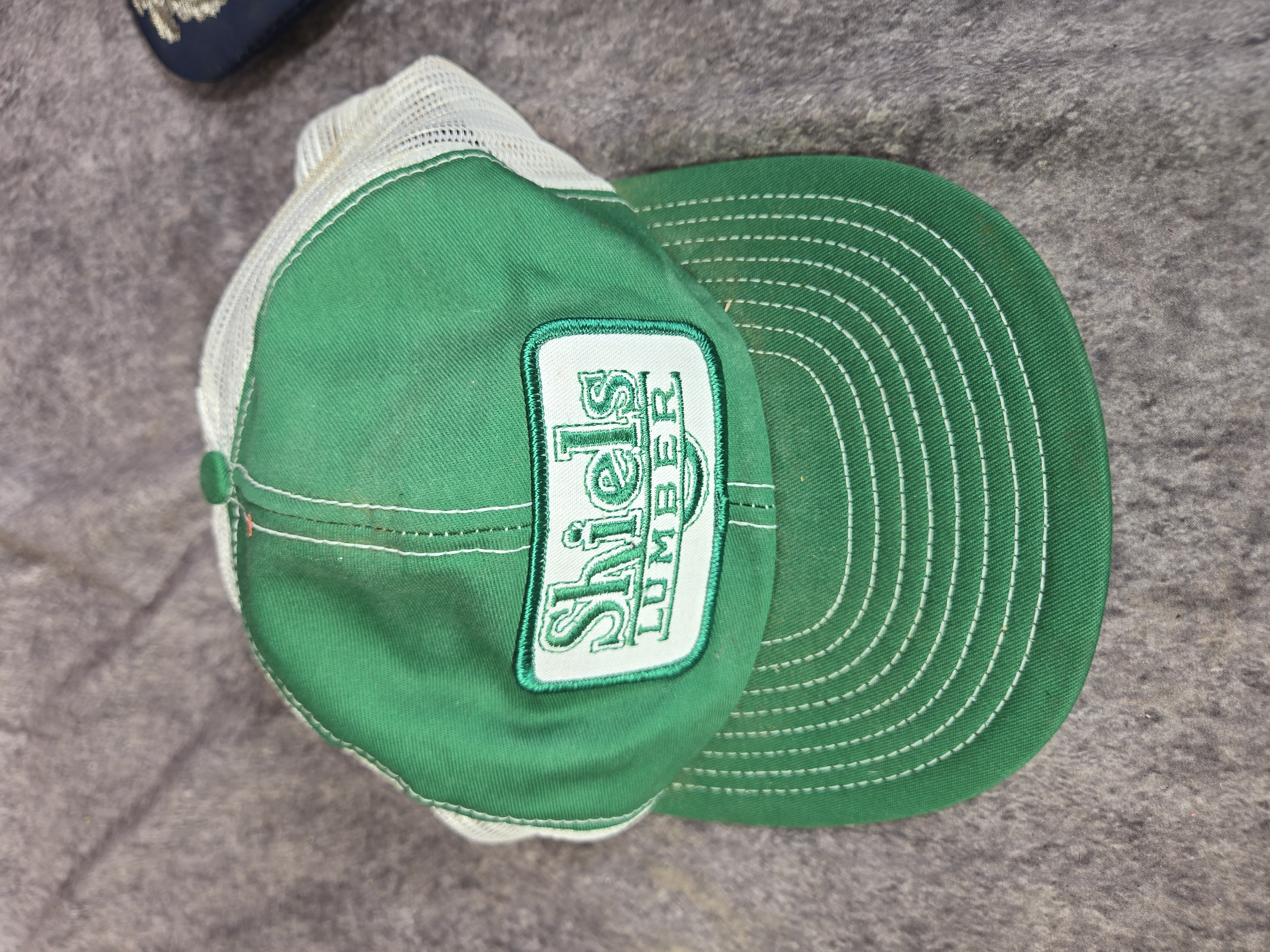 Two Vintage Mesh Trucker Snapback Baseball Caps featuring Shiels Lumber and B-1B Lancer