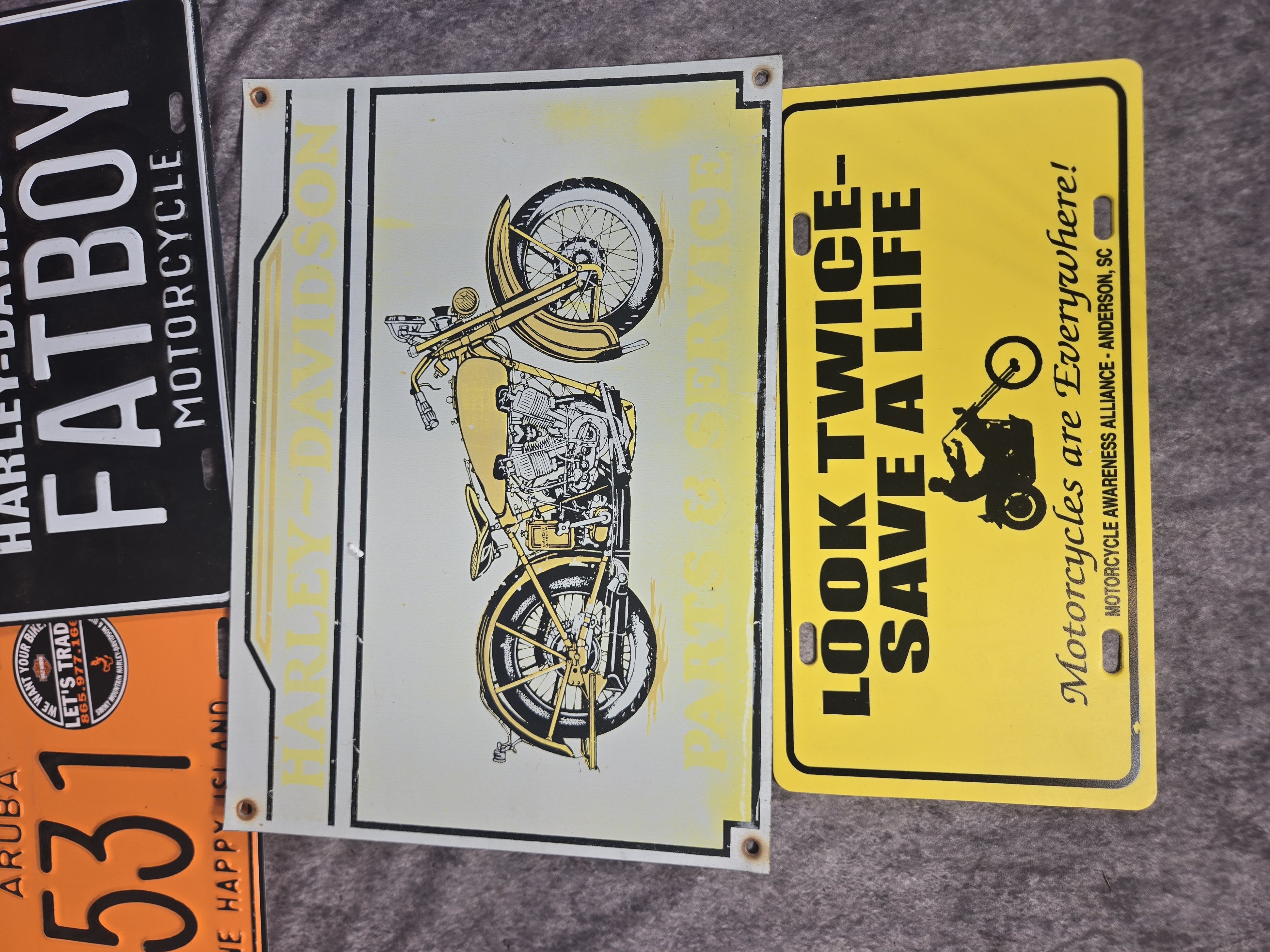 Seven Harley-Davidson and Motorcycle Themed Signs and License Plates