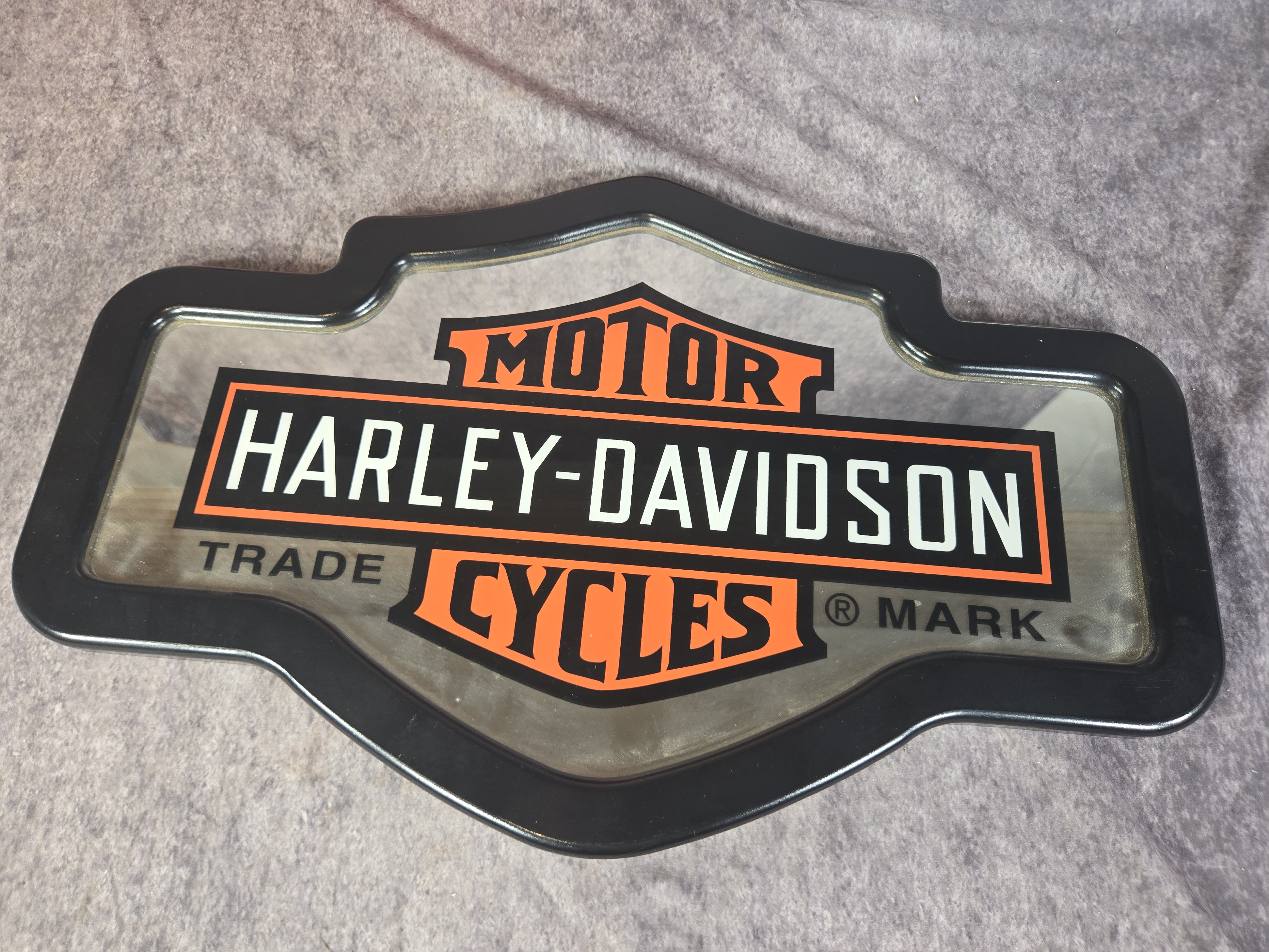 Four Harley-Davidson Branded Decorative Metal Signs and Bar and Shield Mirror