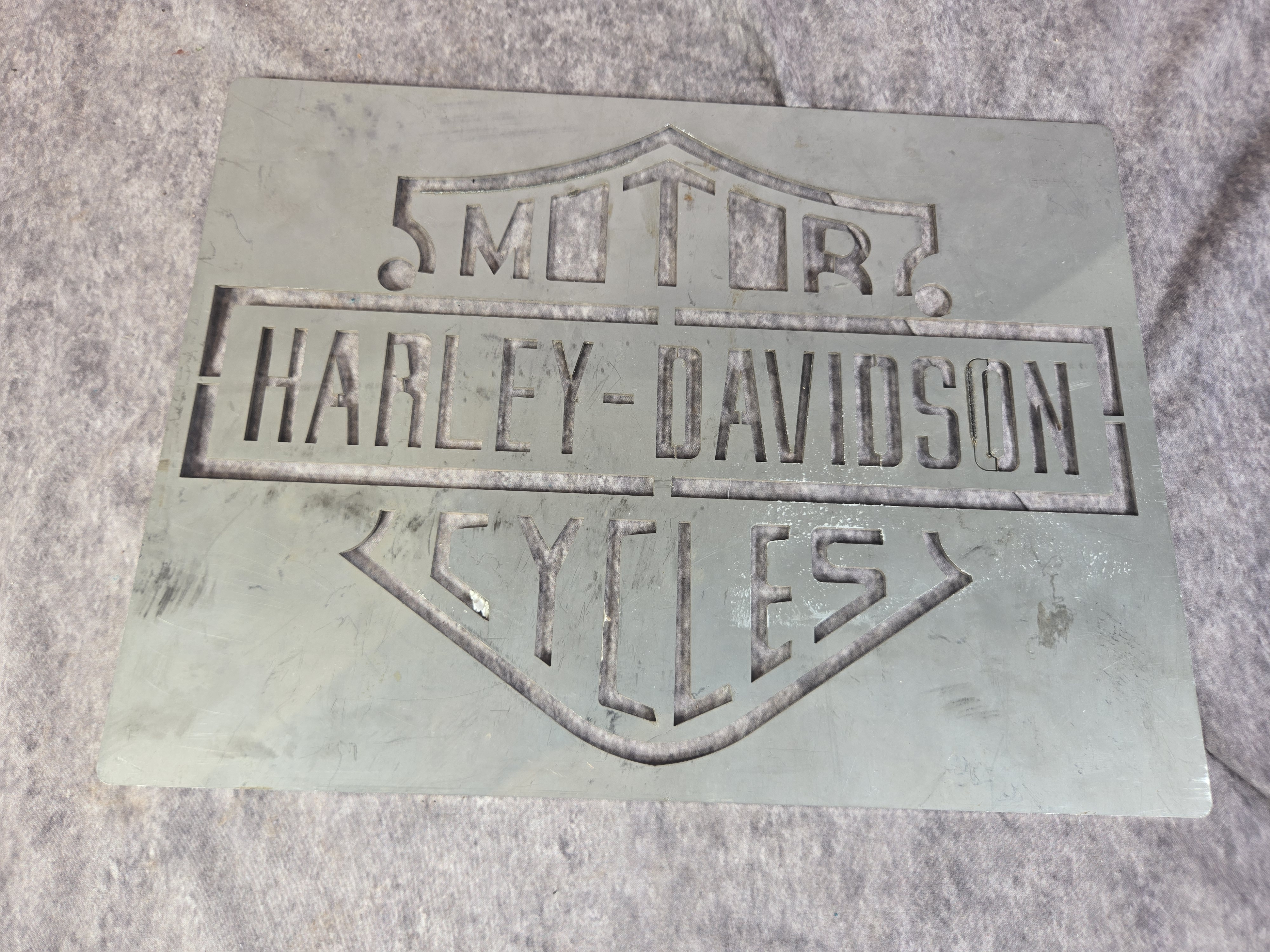 Four Harley-Davidson Branded Decorative Metal Signs and Bar and Shield Mirror