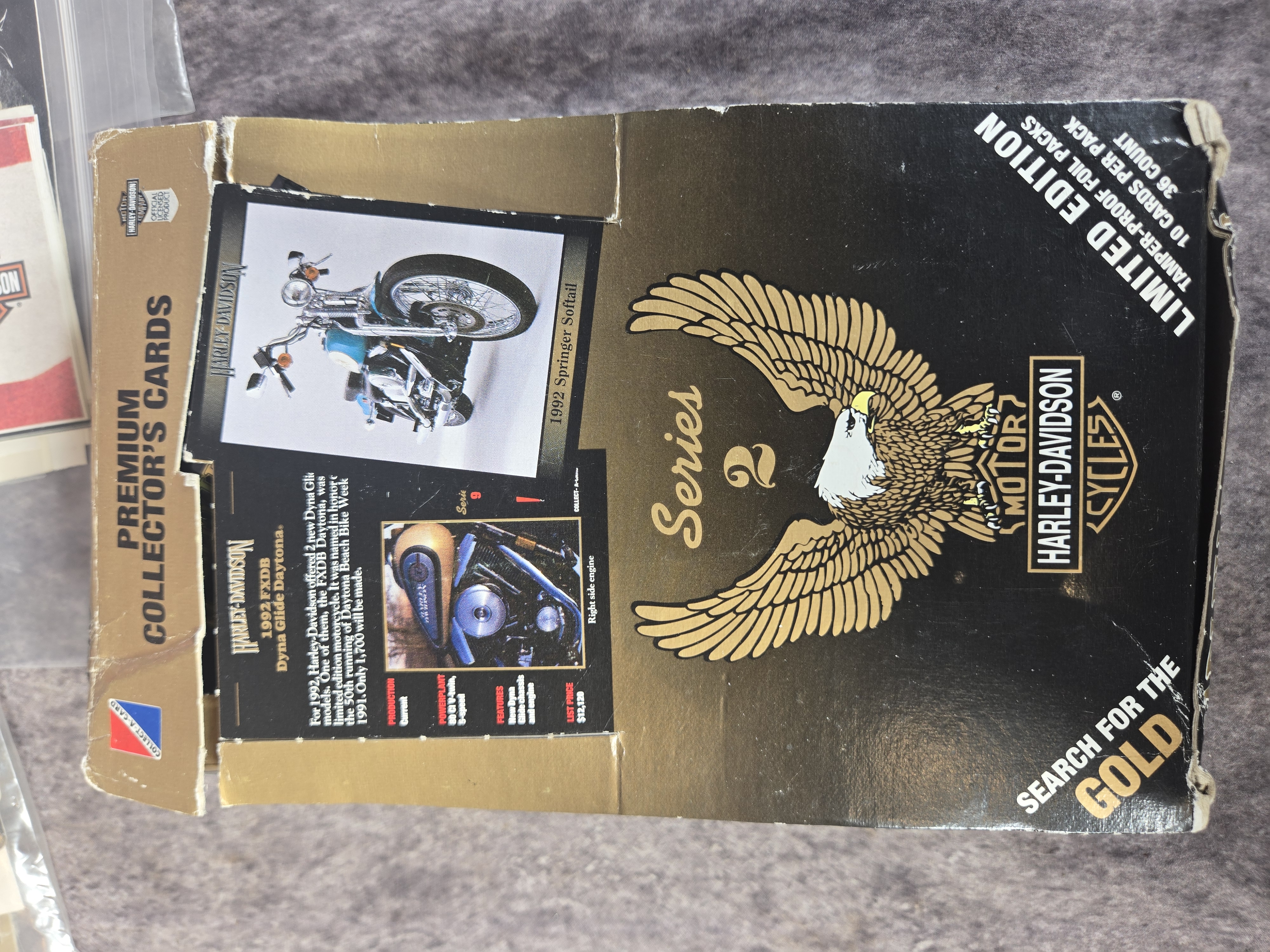 Harley-Davidson Collectibles featuring Unopened Collector Cards, Banner, and Dealership Decals