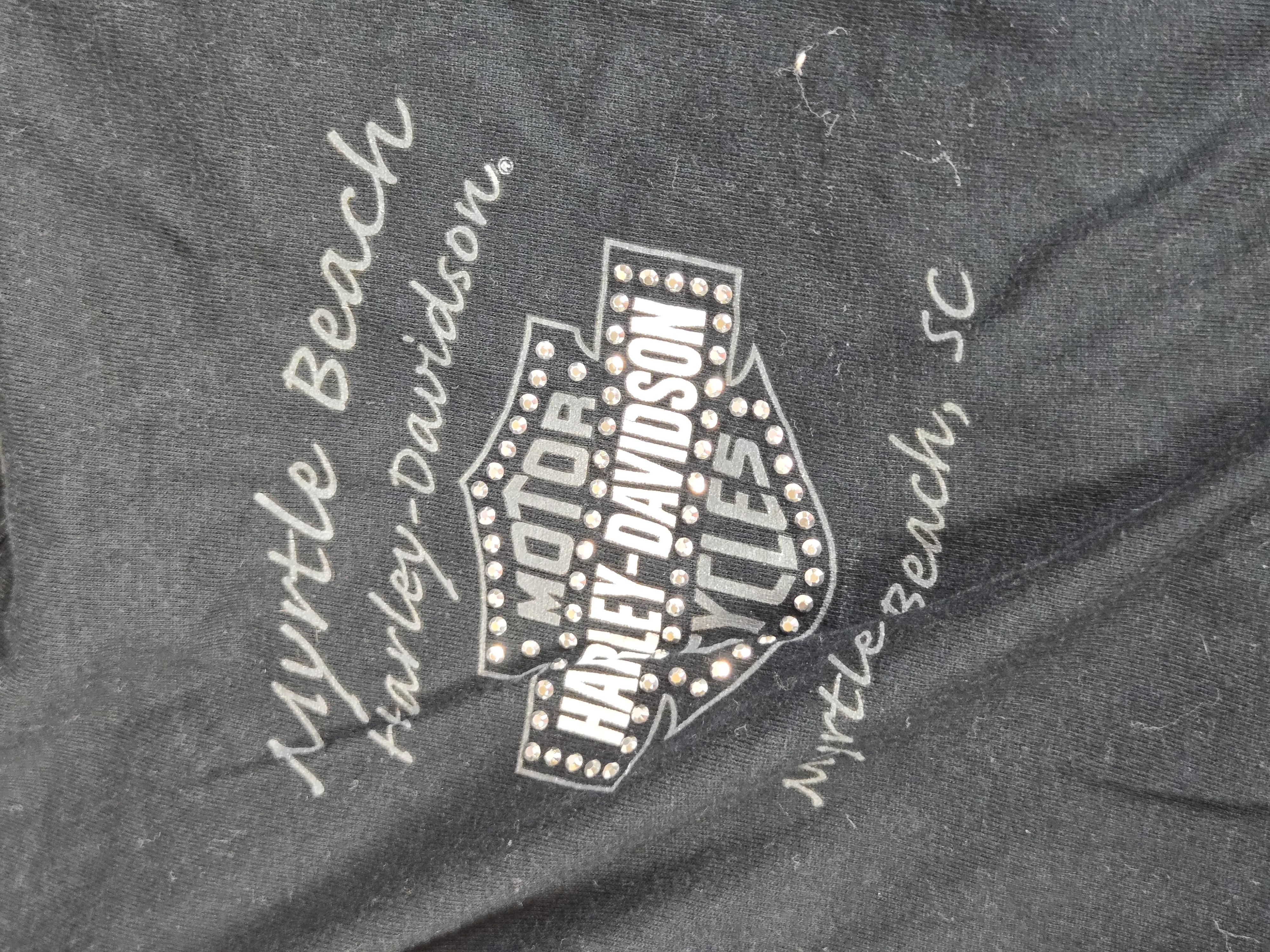 Eleven Women's Harley-Davidson Motorclothes Apparel Pieces featuring Dealer and Anniversary Graphics