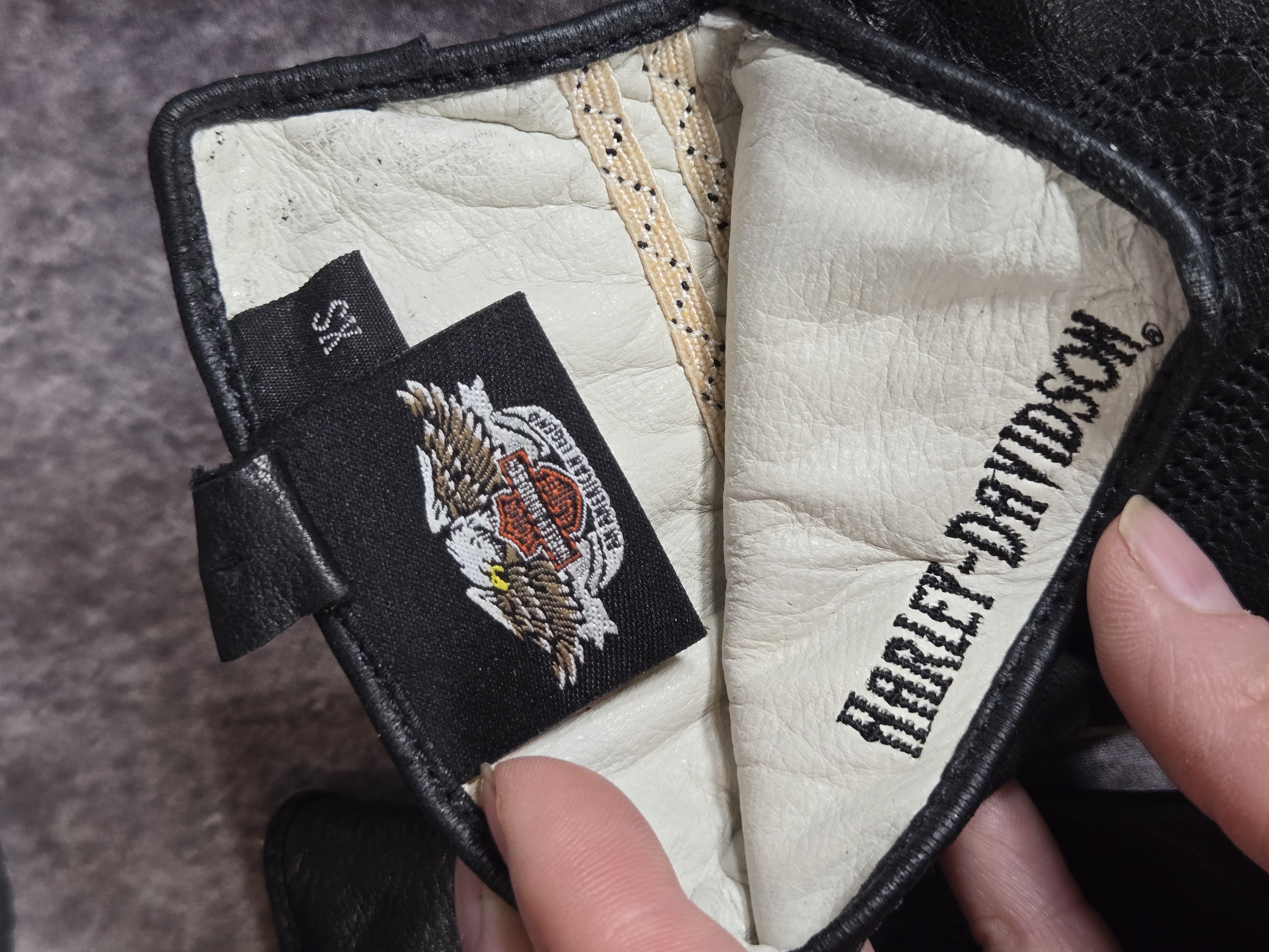 A Group of Harley-Davidson Branded Leather Boots and Apparel
