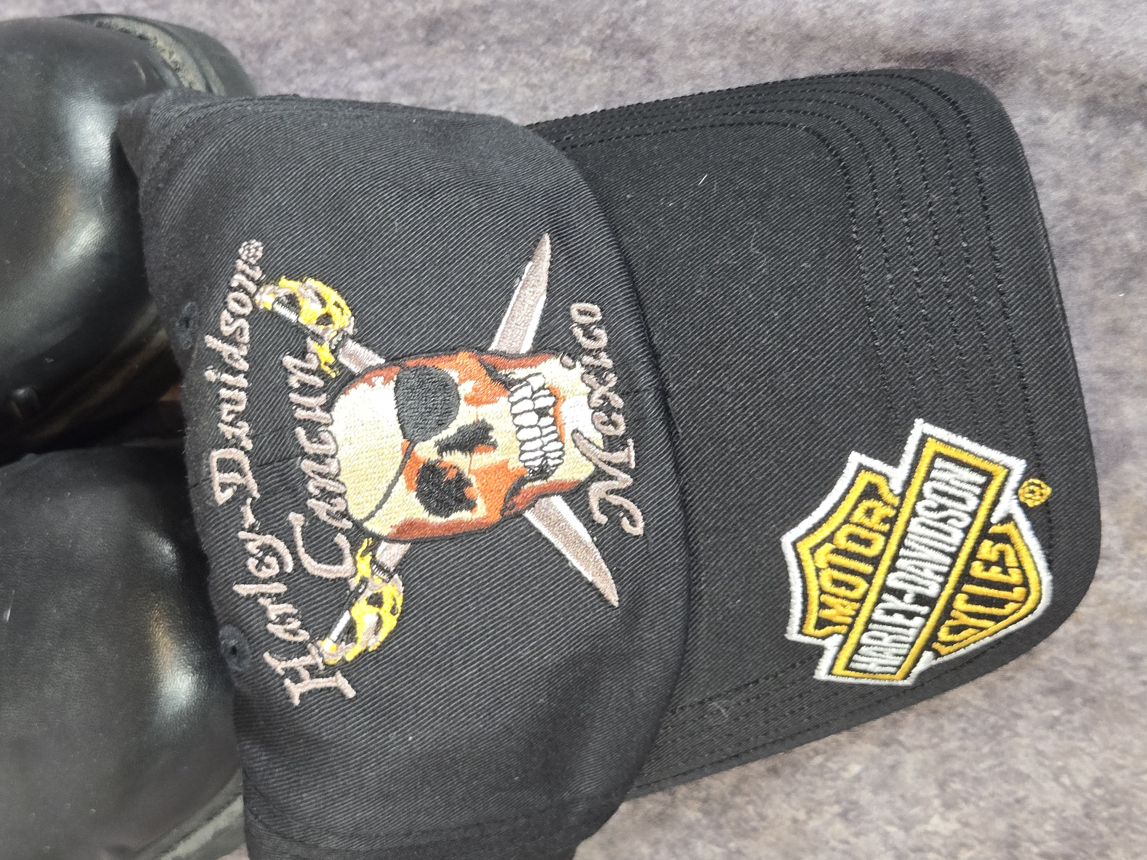 A Group of Harley-Davidson Branded Leather Boots and Apparel