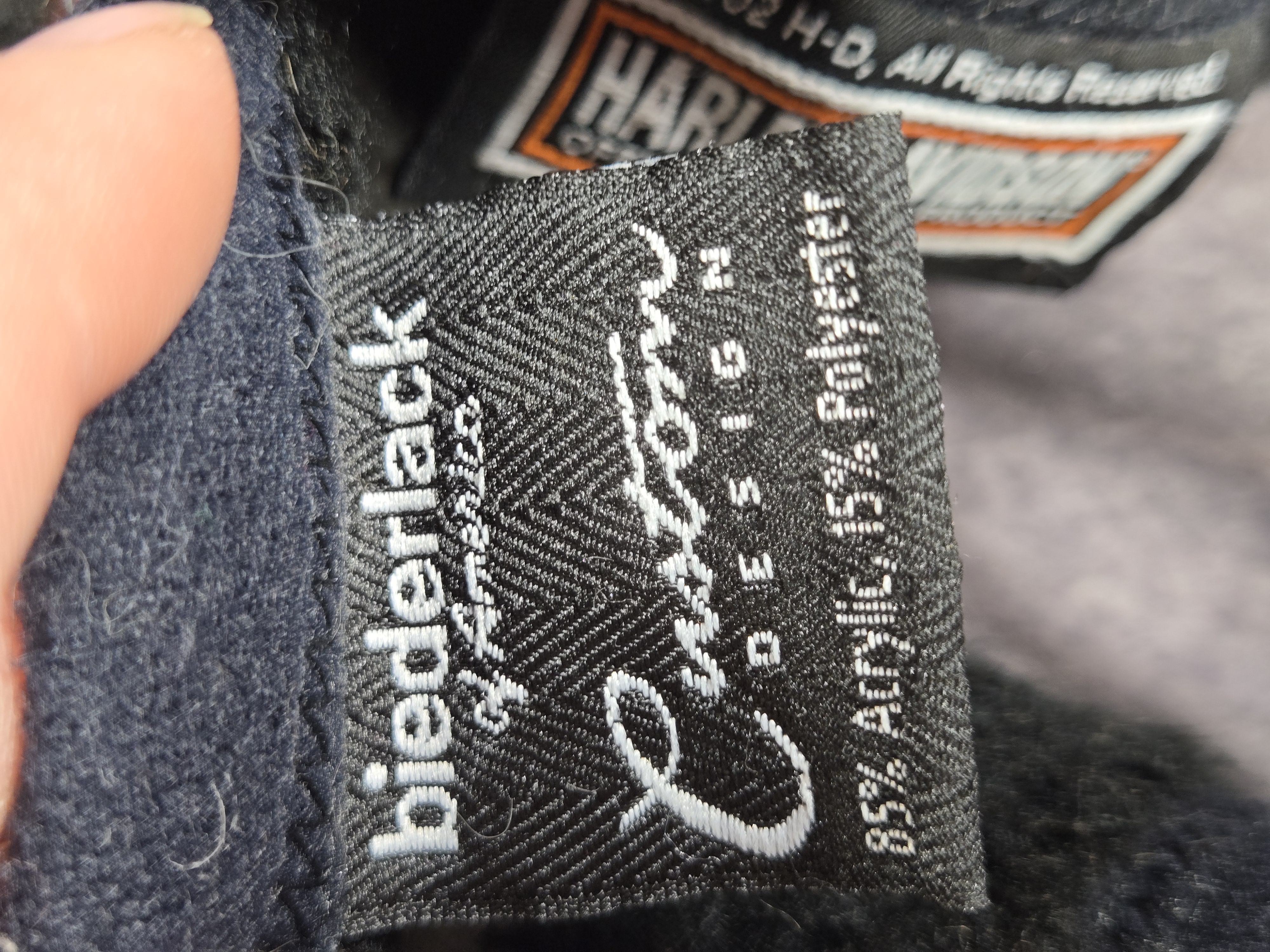 Six Licensed Harley-Davidson Textile Items including Biederlack Blankets and Holoubek Pillows