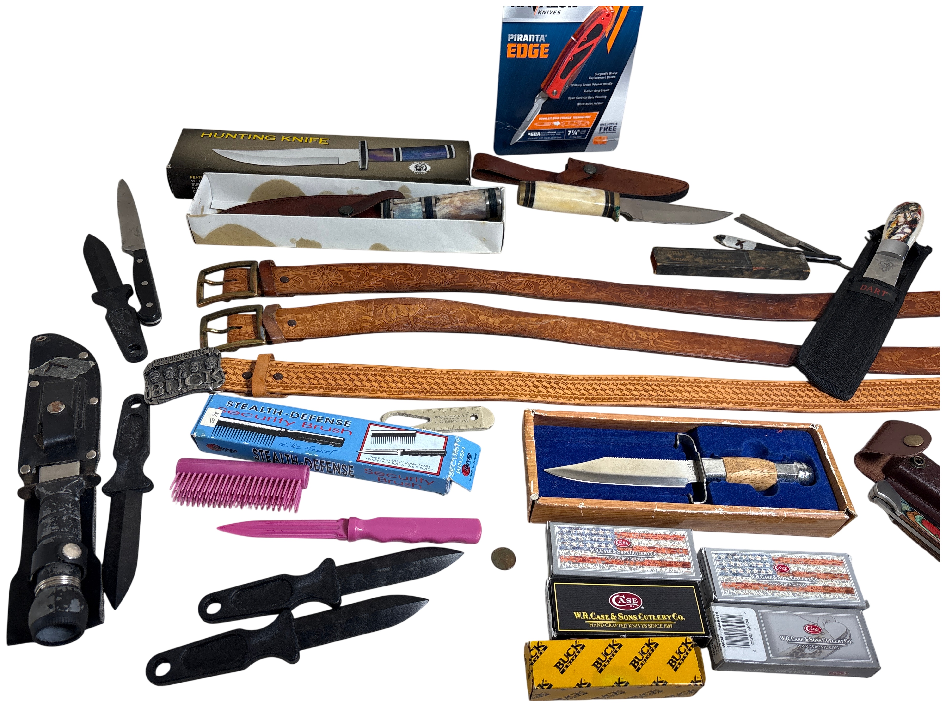 Assorted Hunting and Folding Knives with Tooled Leather Belts and Collectible Case Packaging