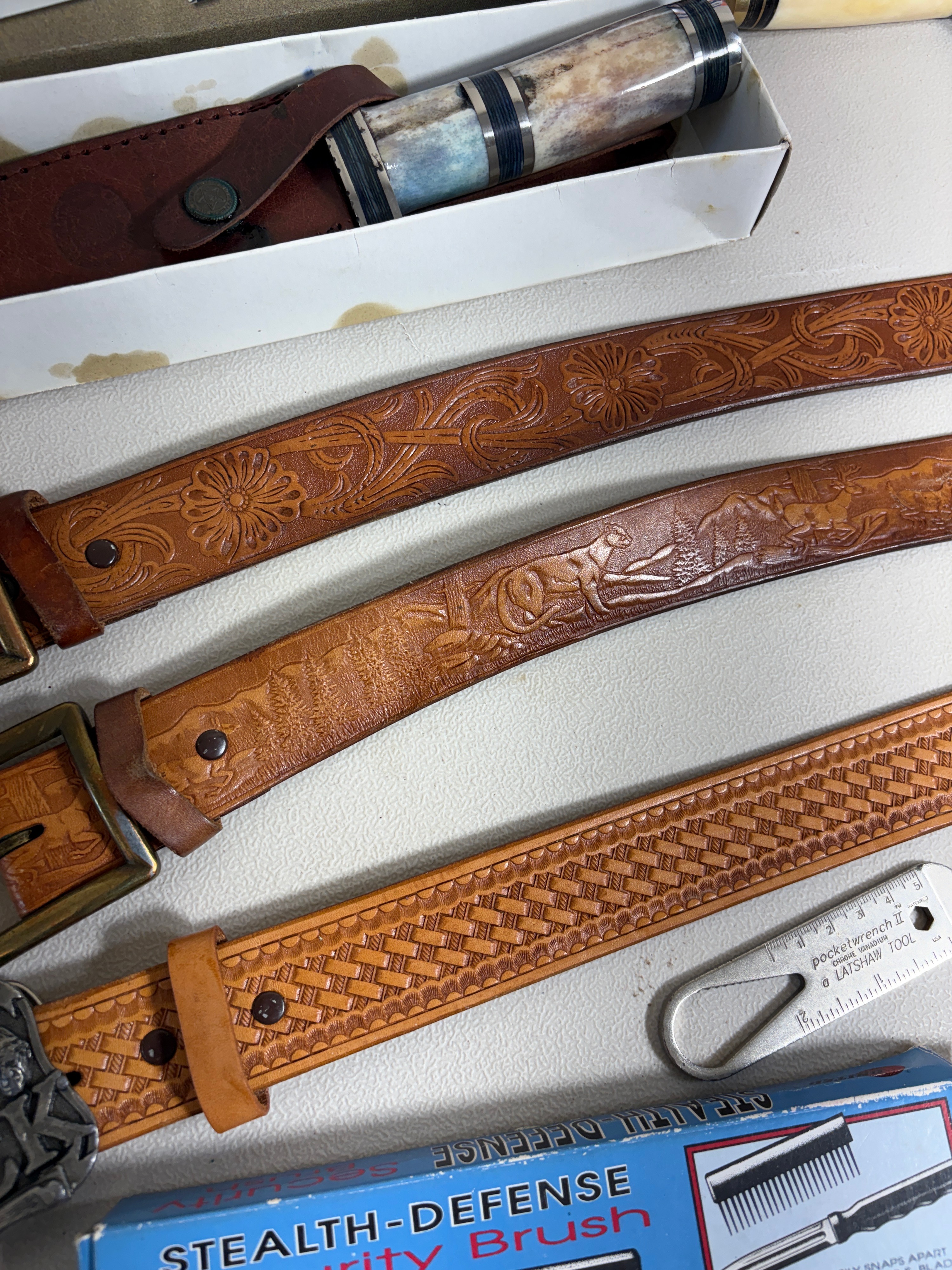 Assorted Hunting and Folding Knives with Tooled Leather Belts and Collectible Case Packaging