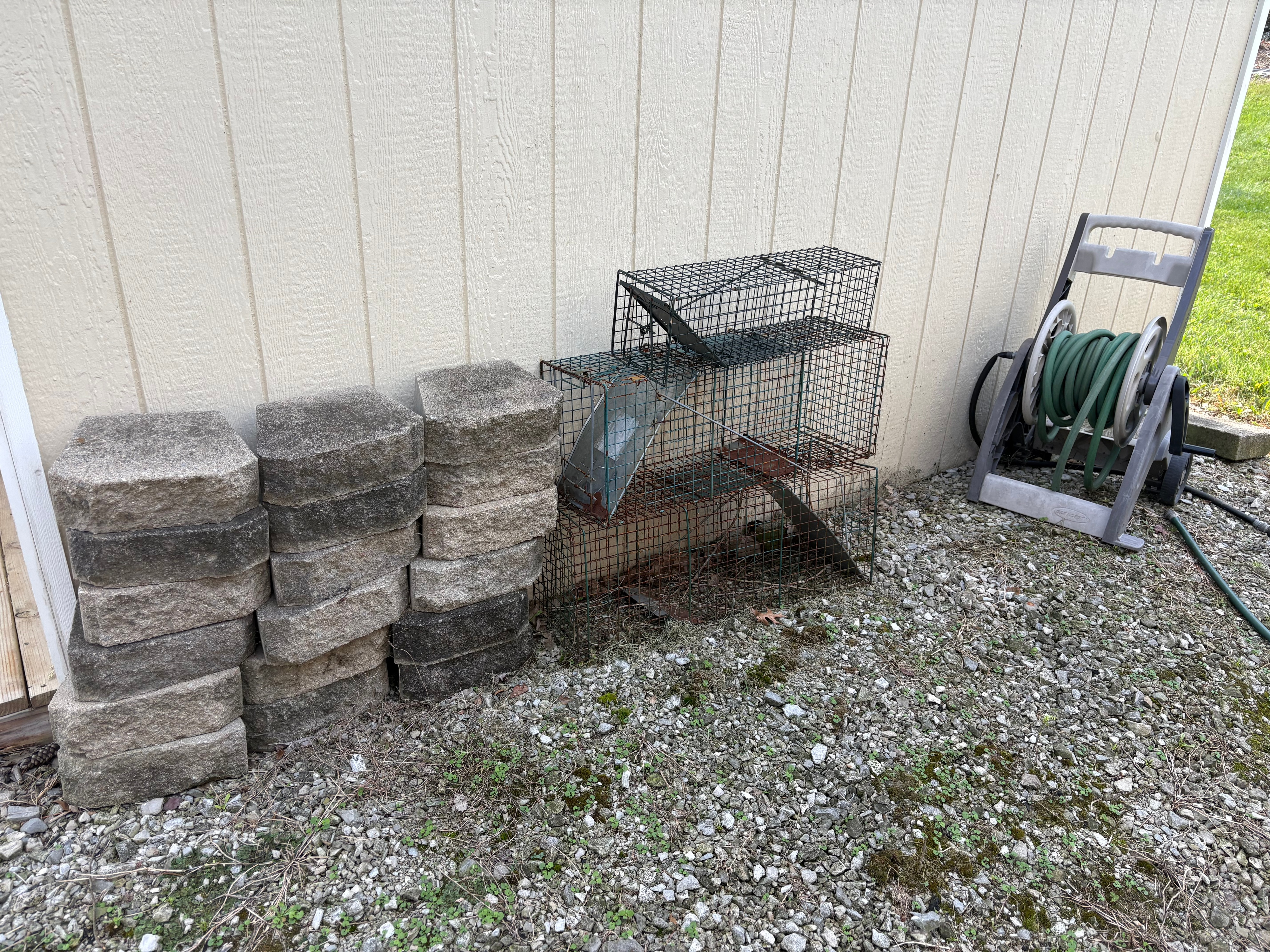 An Assortment of Garden Decor and Utility Equipment including an Ames Wheelbarrow