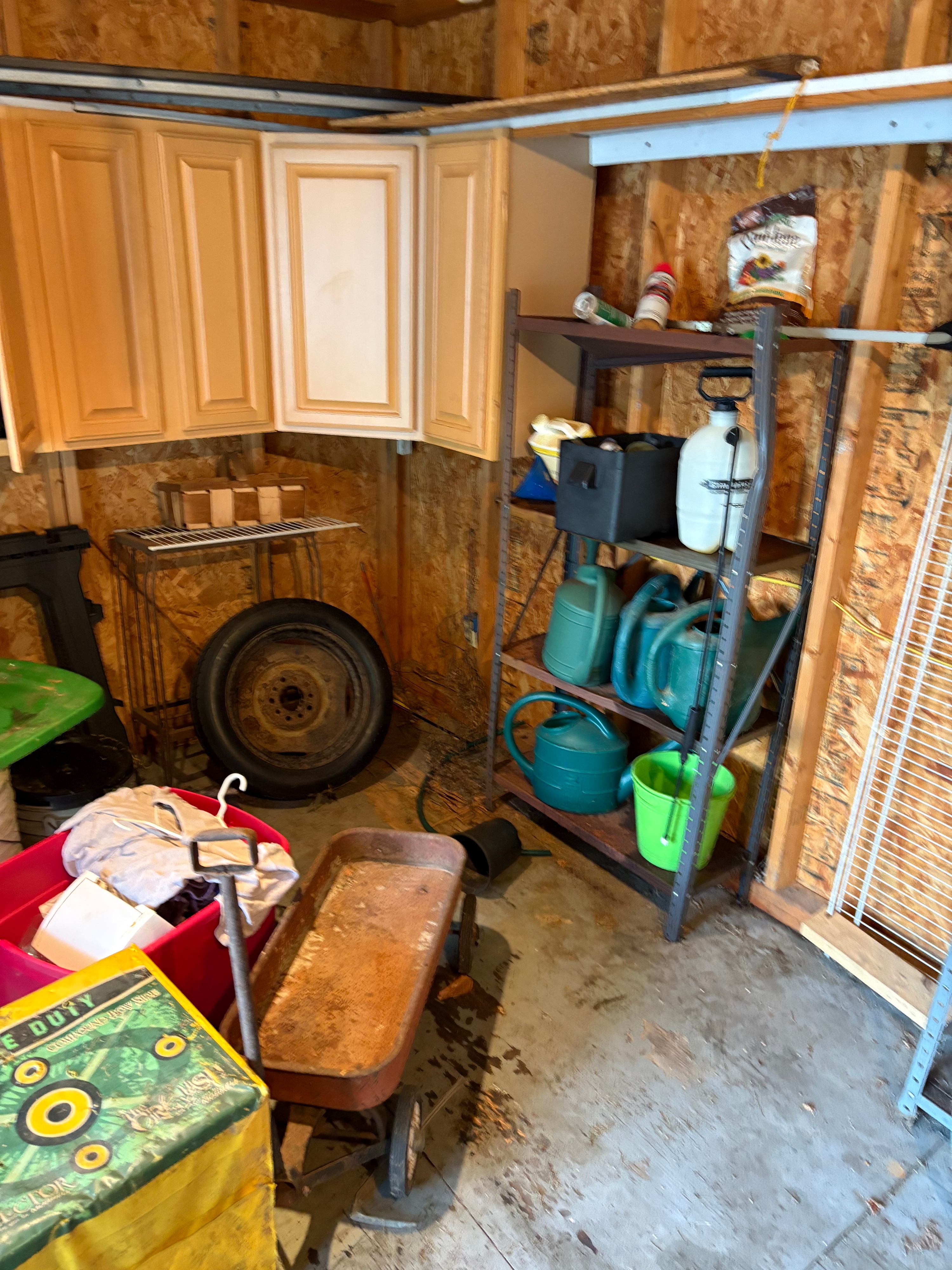 A Large Collection of Storage Shed Contents Including a Western Flyer Wagon, Morrell Archery Target, Shelving Units, and Garden Equipment