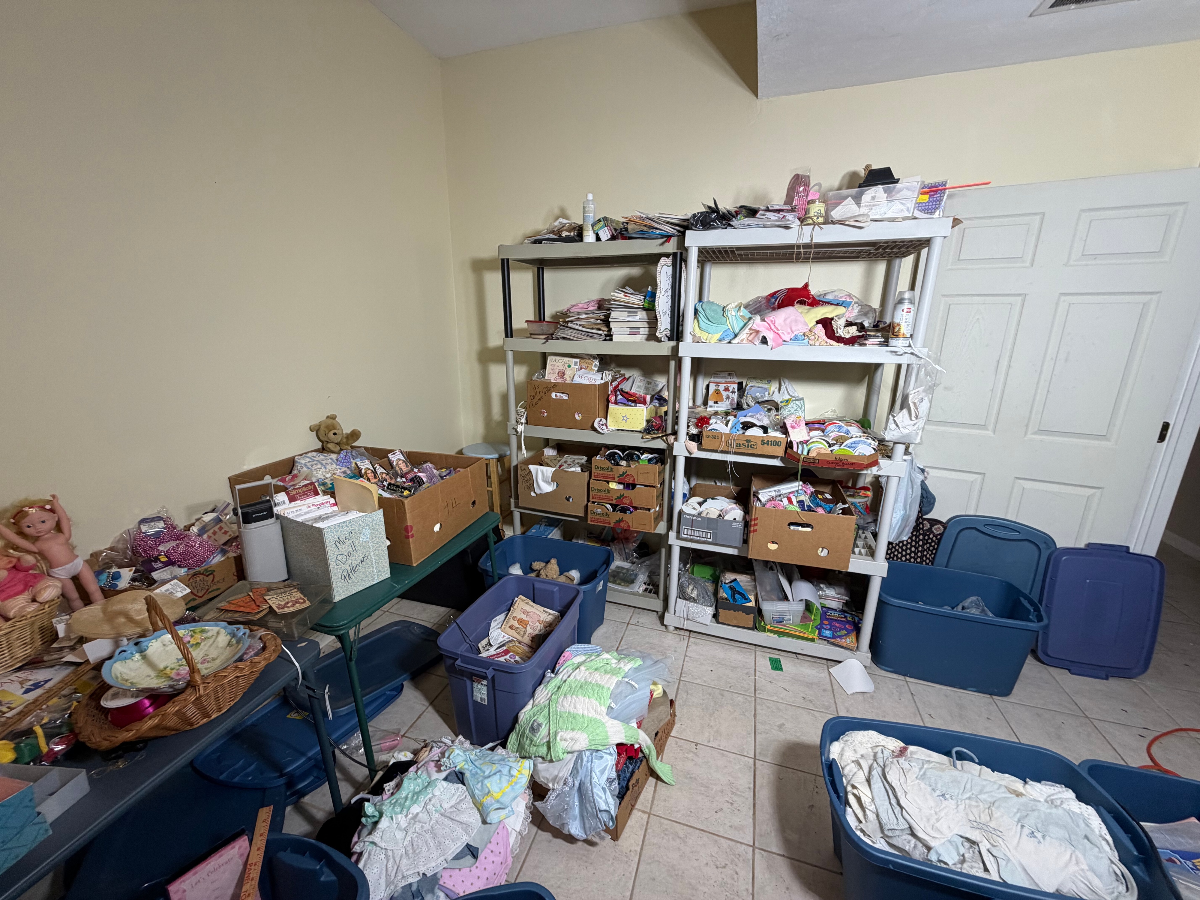 CONTENTS LOT: A Large Collection of Cabbage Patch Kids, American Girl, and Barbie Dolls with Sewing Patterns, Craft Kits, and Trims