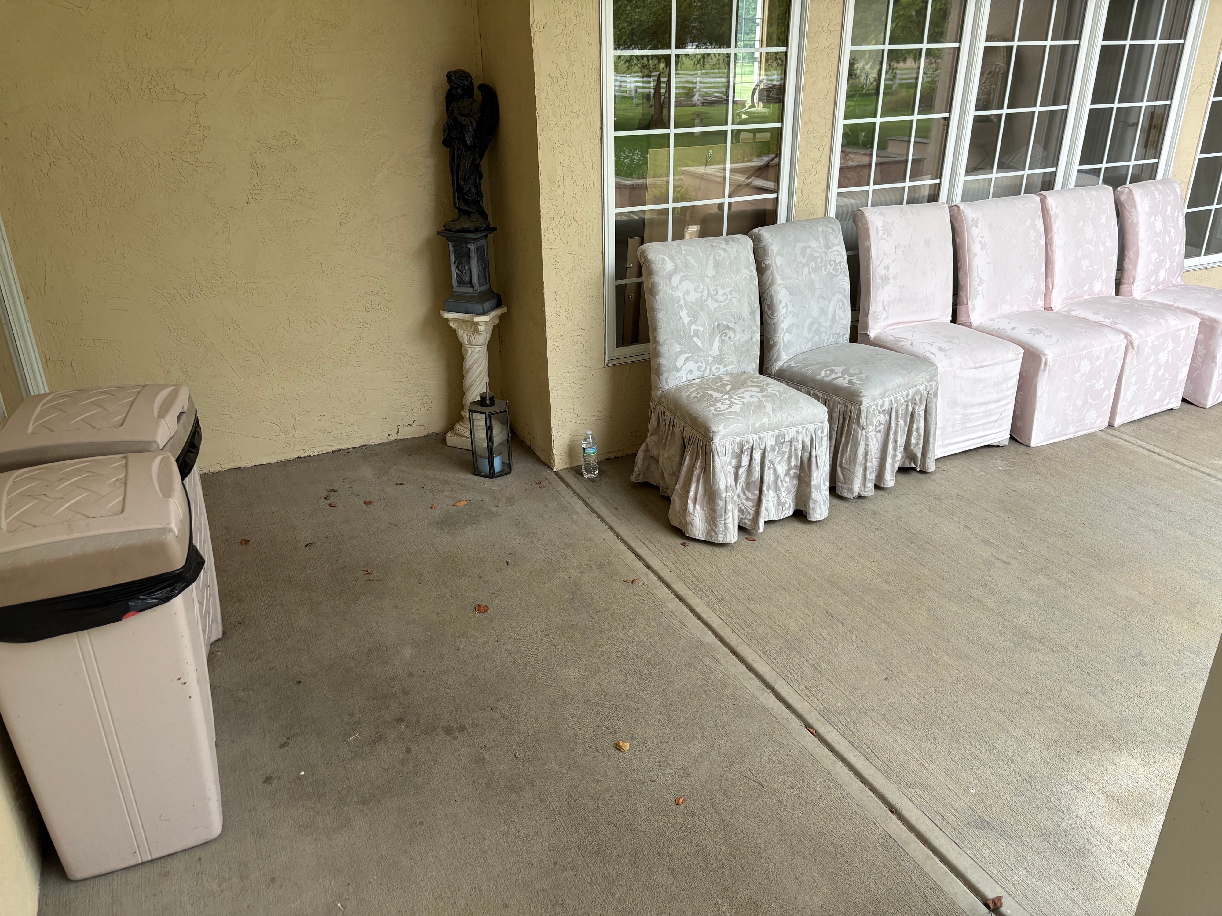 A Collection of Outdoor Patio Furniture Garden Statuary and Planters