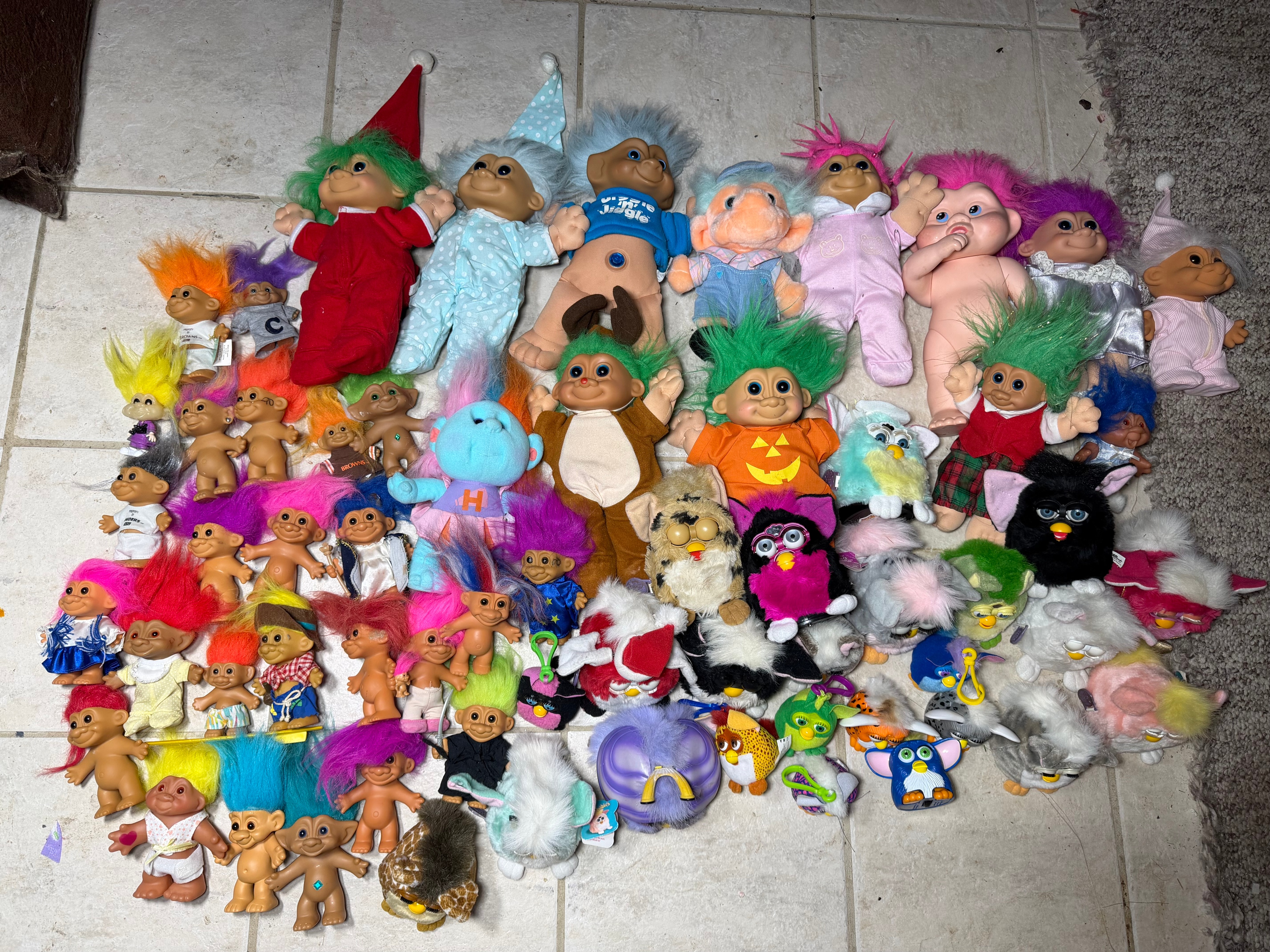A Collection of Vintage 1990s Tiger Electronics Furby Toys and Assorted Troll Dolls