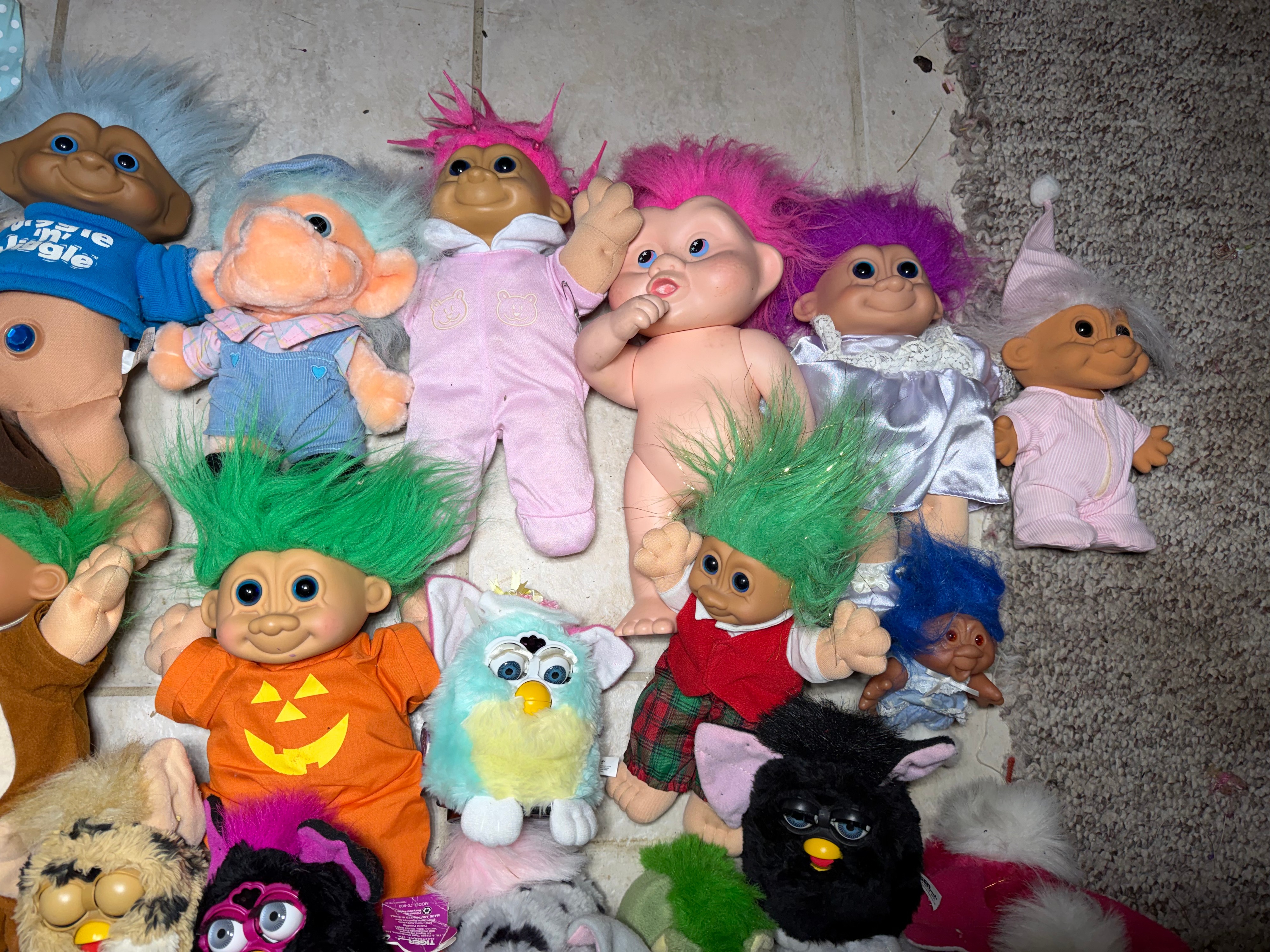 A Collection of Vintage 1990s Tiger Electronics Furby Toys and Assorted Troll Dolls
