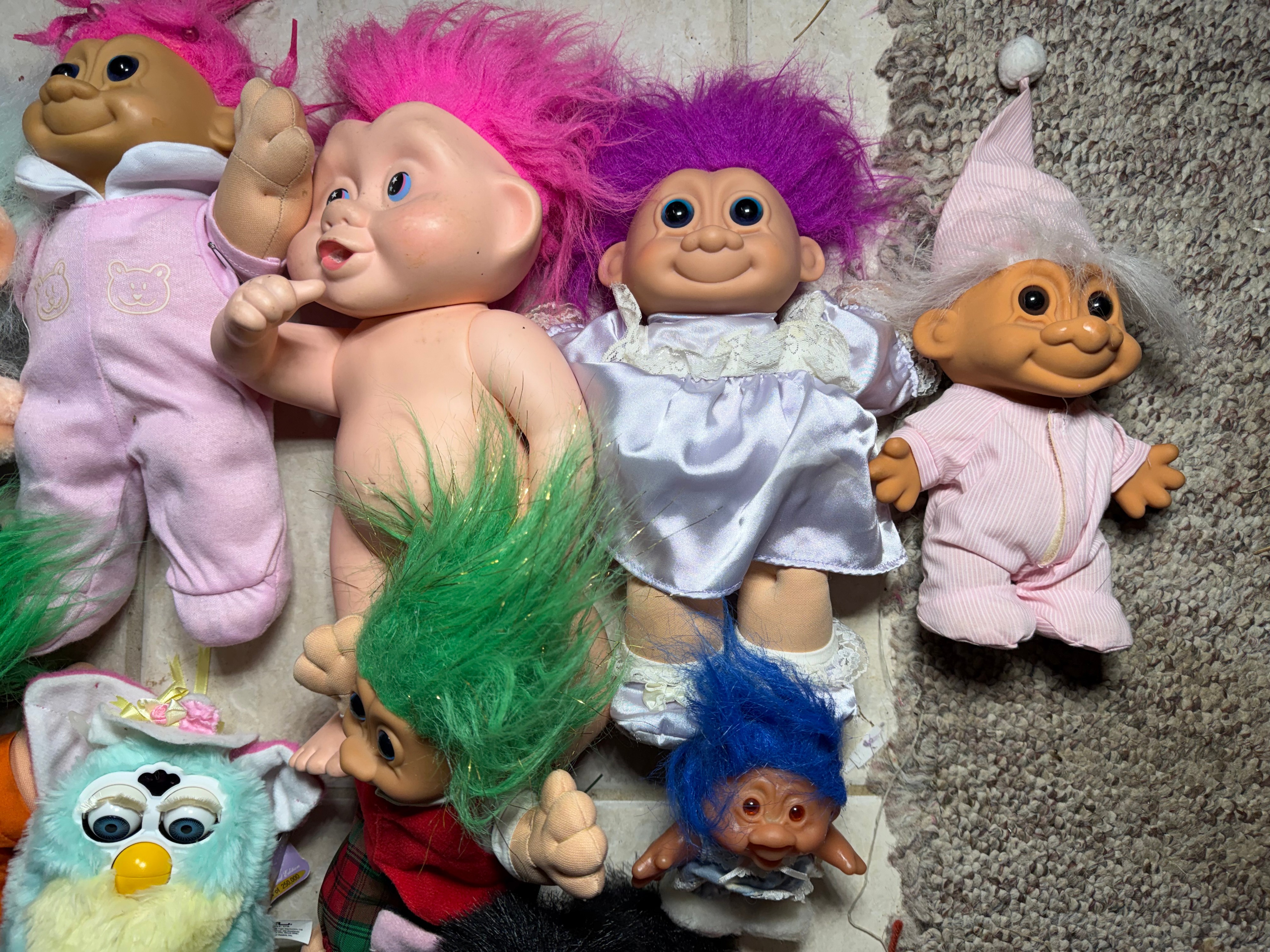 A Collection of Vintage 1990s Tiger Electronics Furby Toys and Assorted Troll Dolls