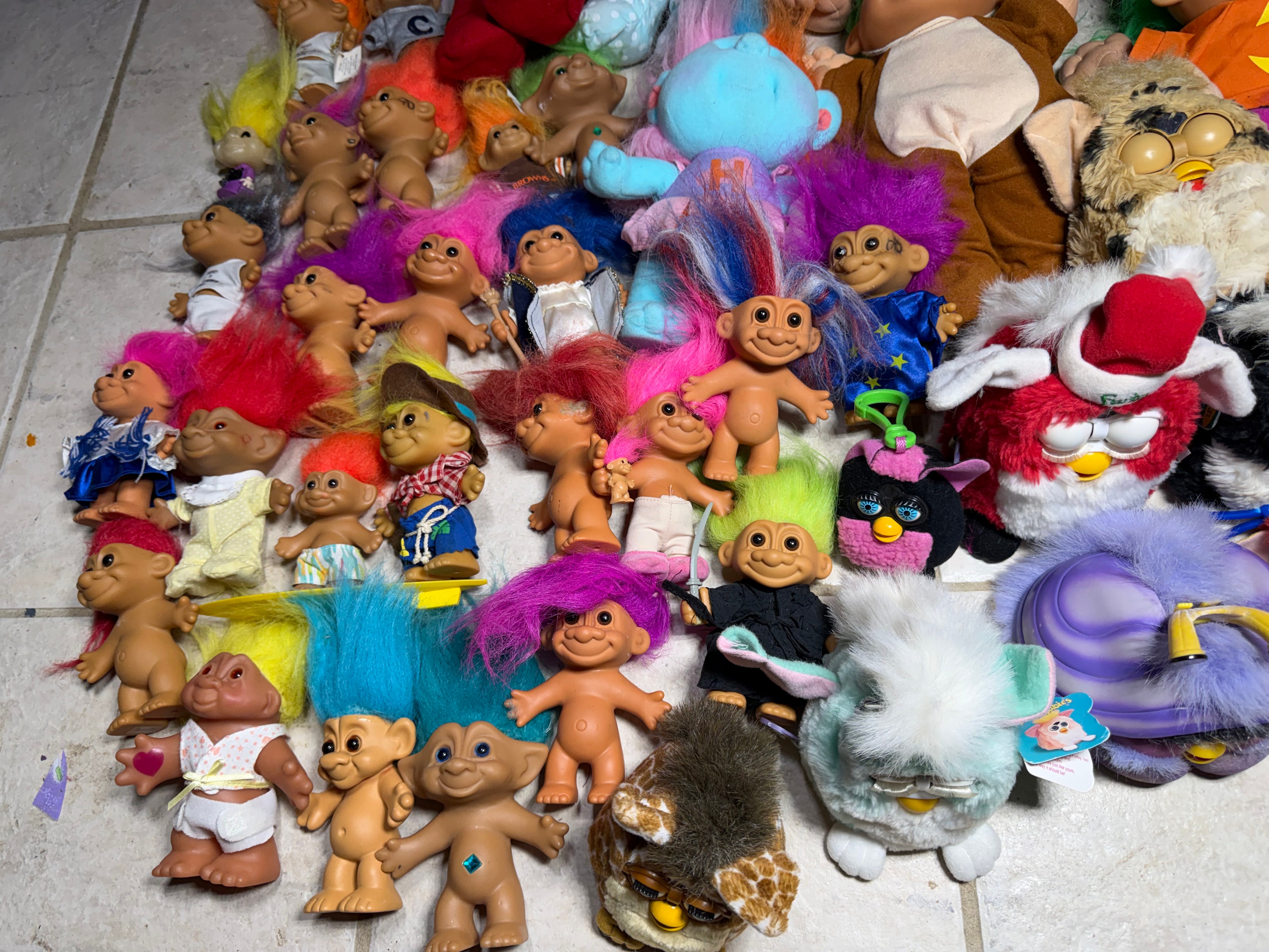 A Collection of Vintage 1990s Tiger Electronics Furby Toys and Assorted Troll Dolls