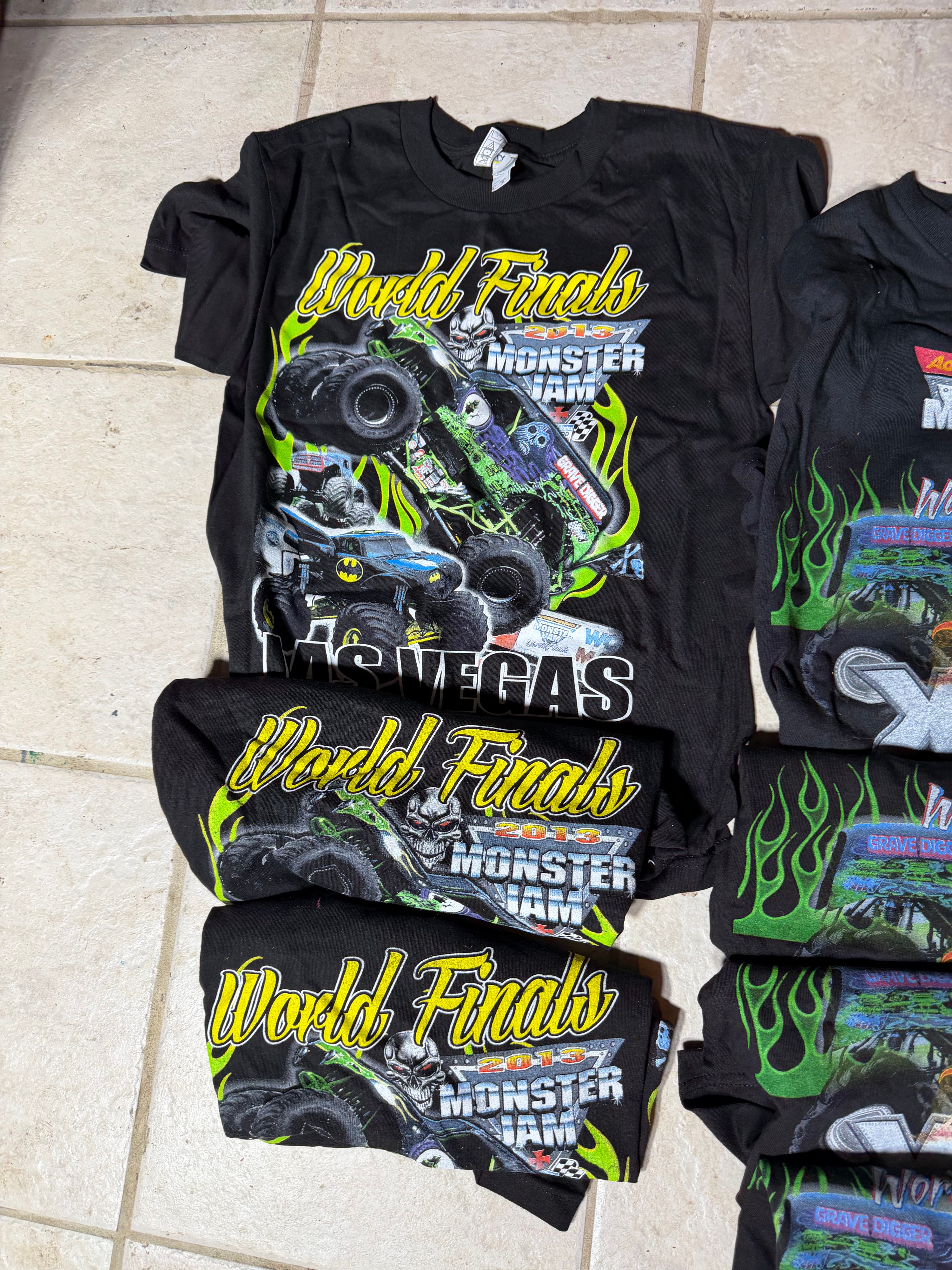 A Collection of Souvenir Event T-Shirts Featuring 2013 Monster Jam and Midwestern Music Festivals