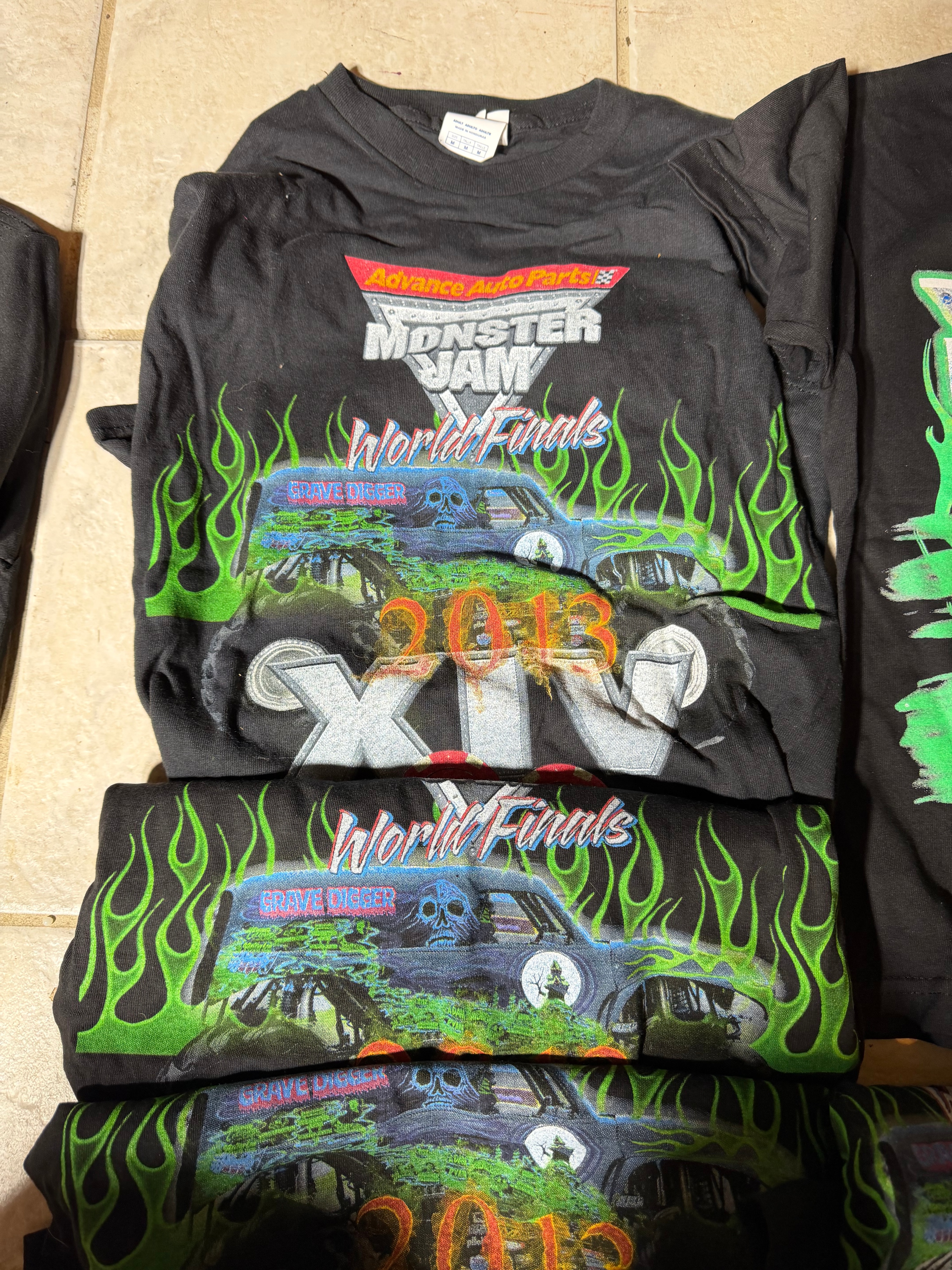 A Collection of Souvenir Event T-Shirts Featuring 2013 Monster Jam and Midwestern Music Festivals