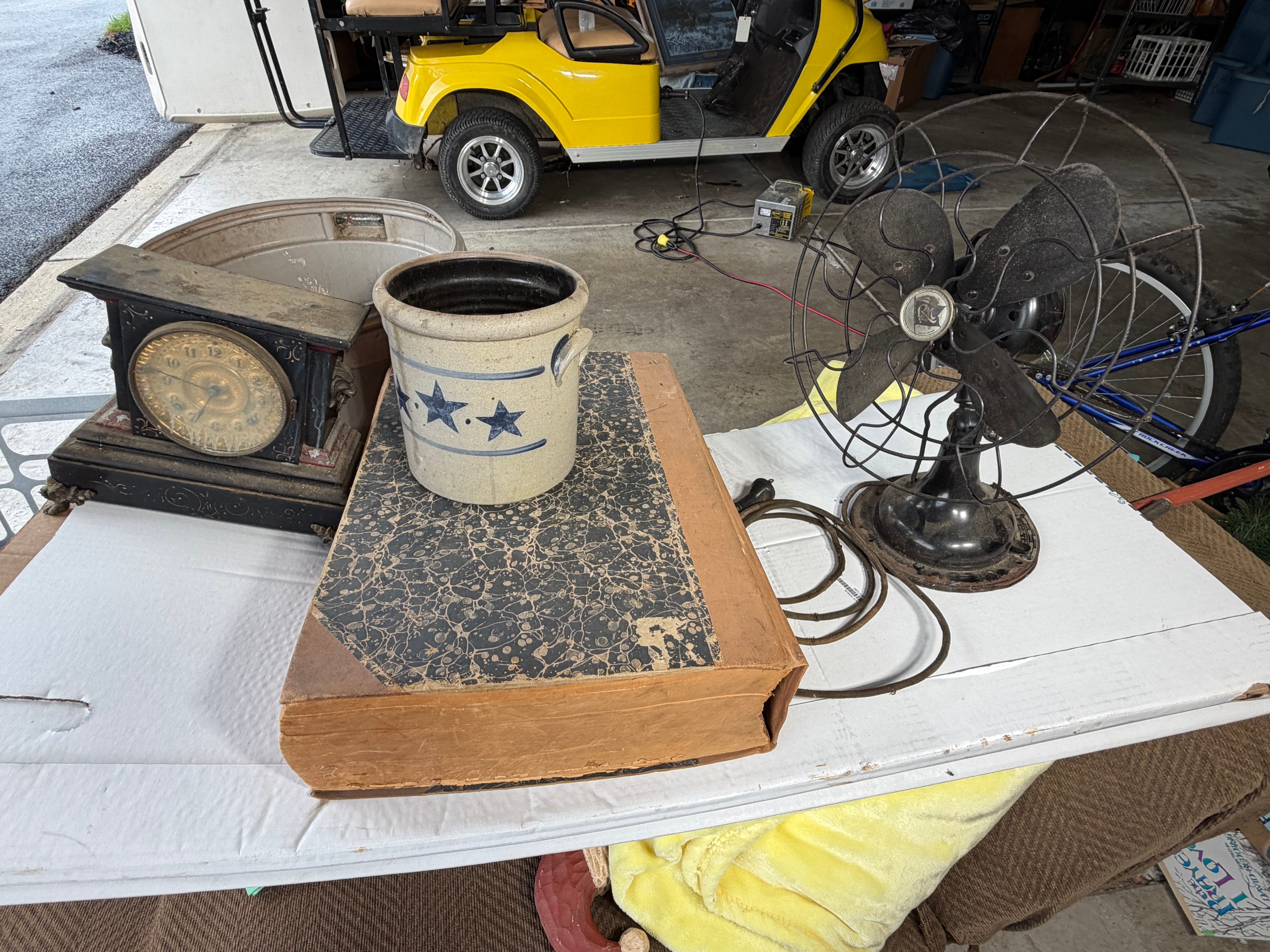 An Assortment of Antique and Vintage Items including an Ansonia Mantel Clock, Robbins and Myers Fan, and Newspaper Archive