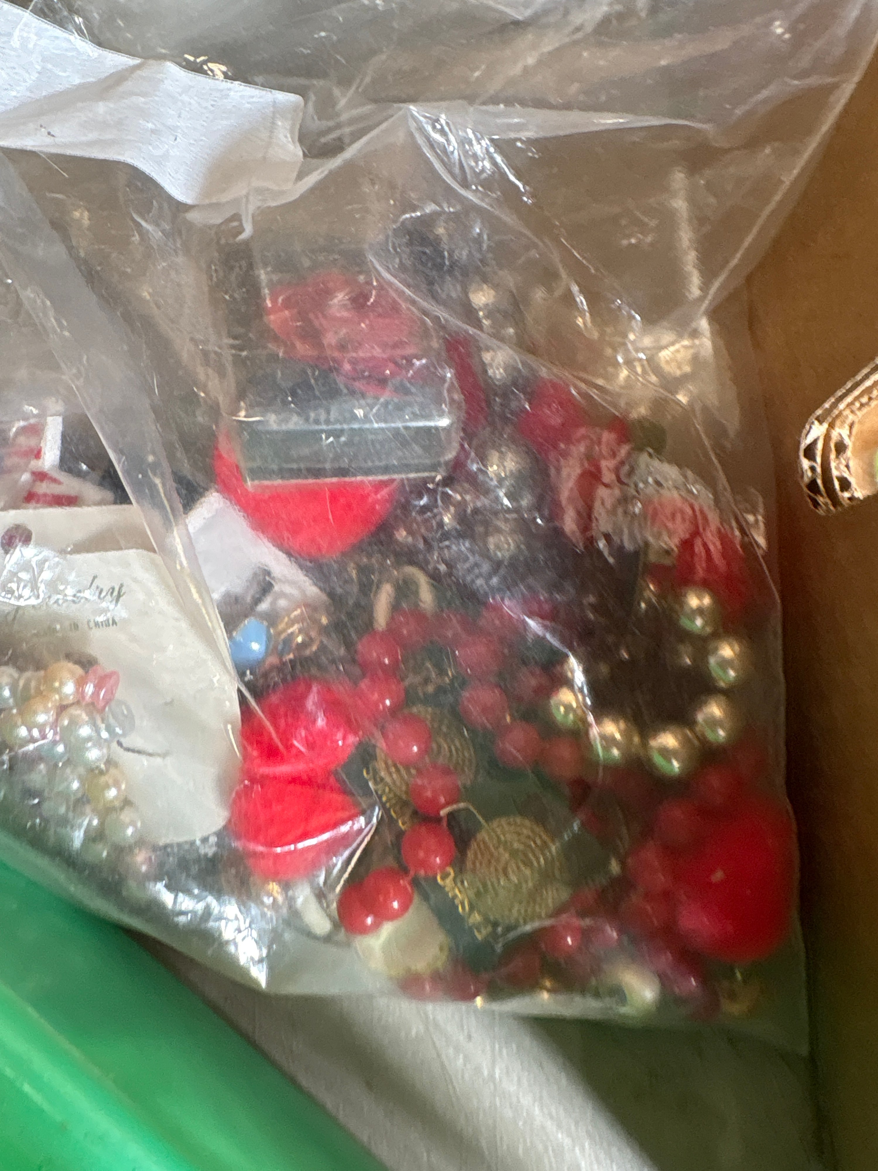 An Assortment of Vintage Costume Jewelry, Sewing Notions, Buttons, and Hardware