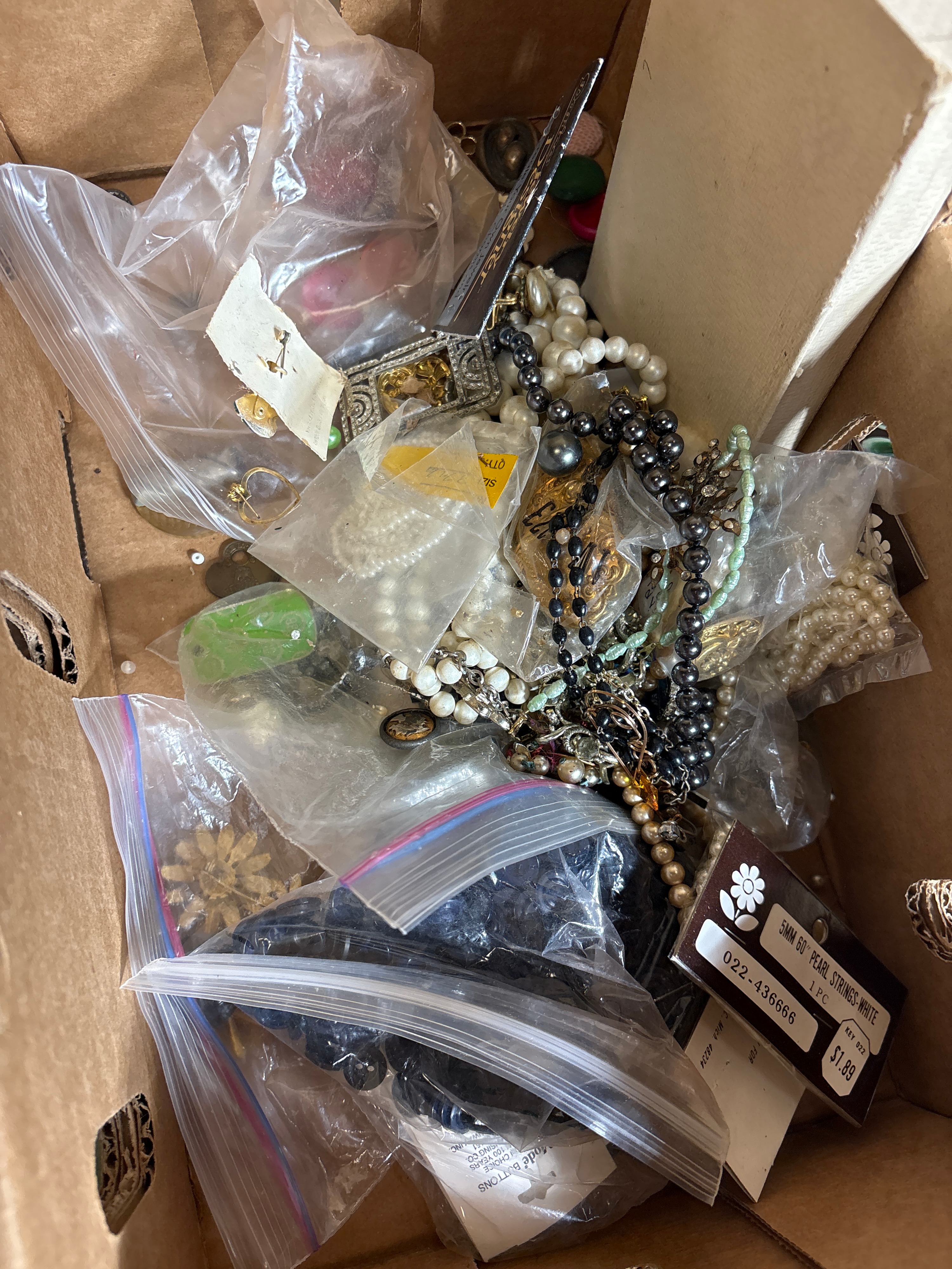 An Assortment of Vintage Costume Jewelry, Sewing Notions, Buttons, and Hardware