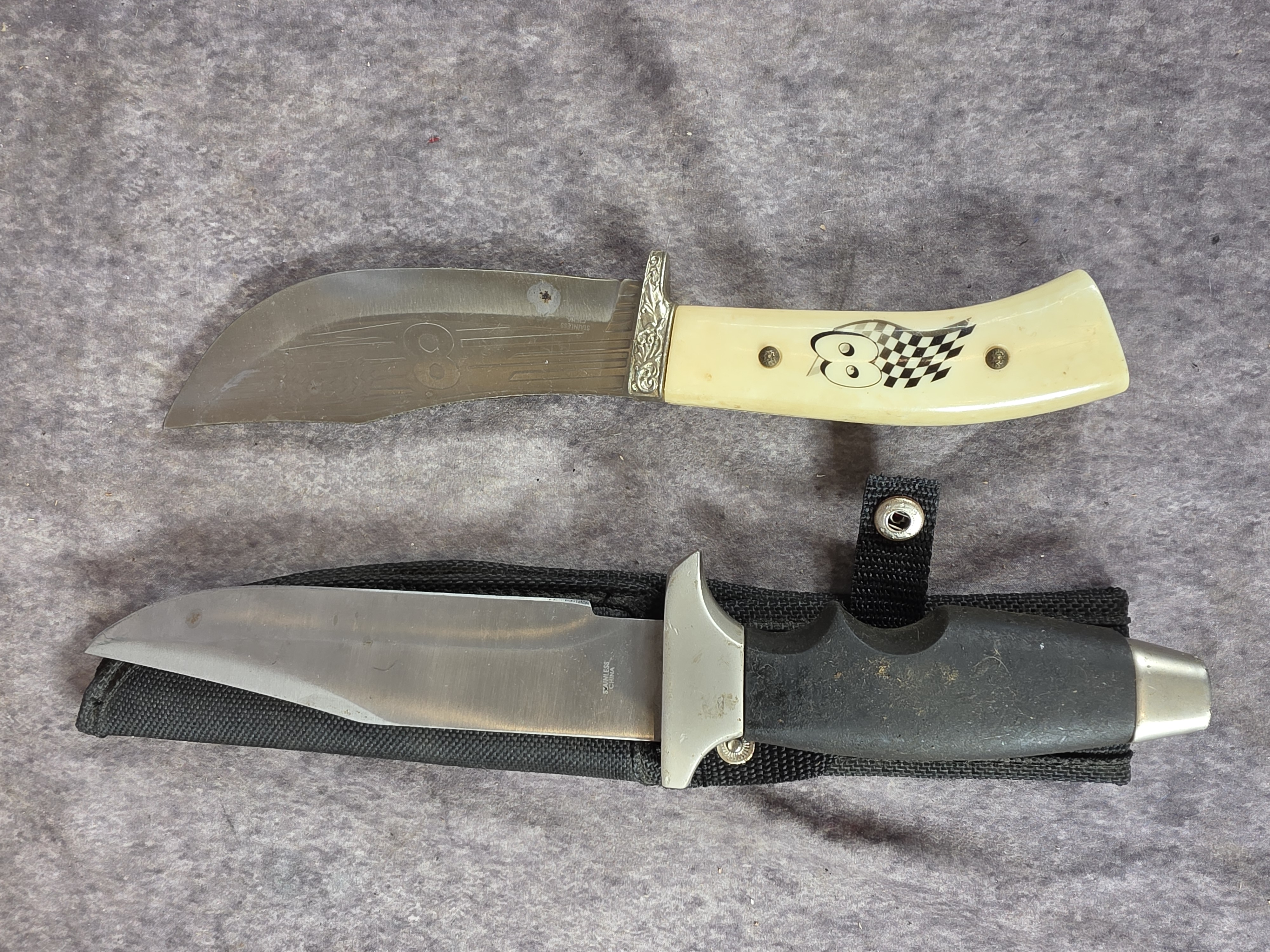 A Collection of Eight Oversized Folding and Fixed Blade Knives from Pakistan and China