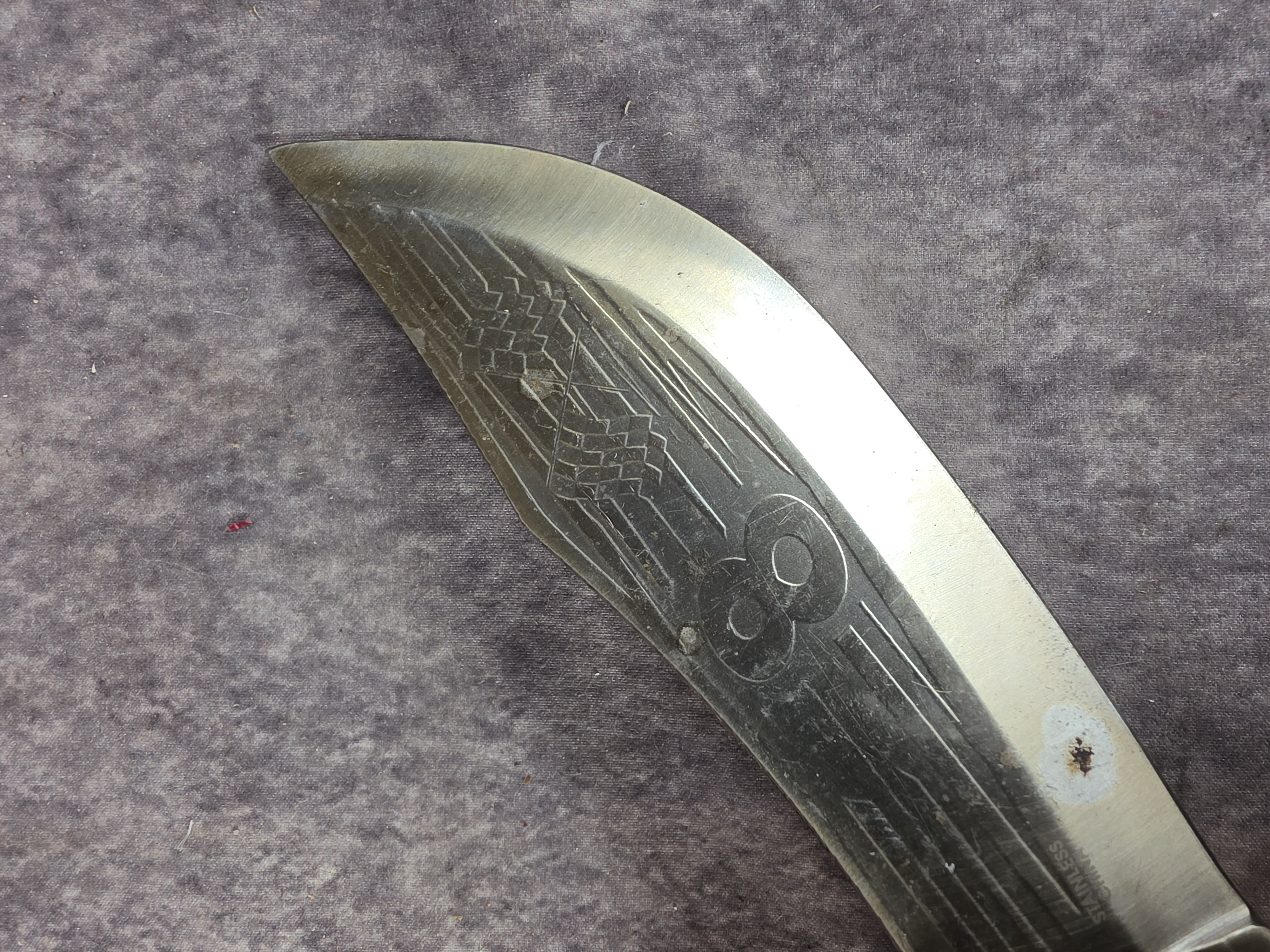A Collection of Eight Oversized Folding and Fixed Blade Knives from Pakistan and China
